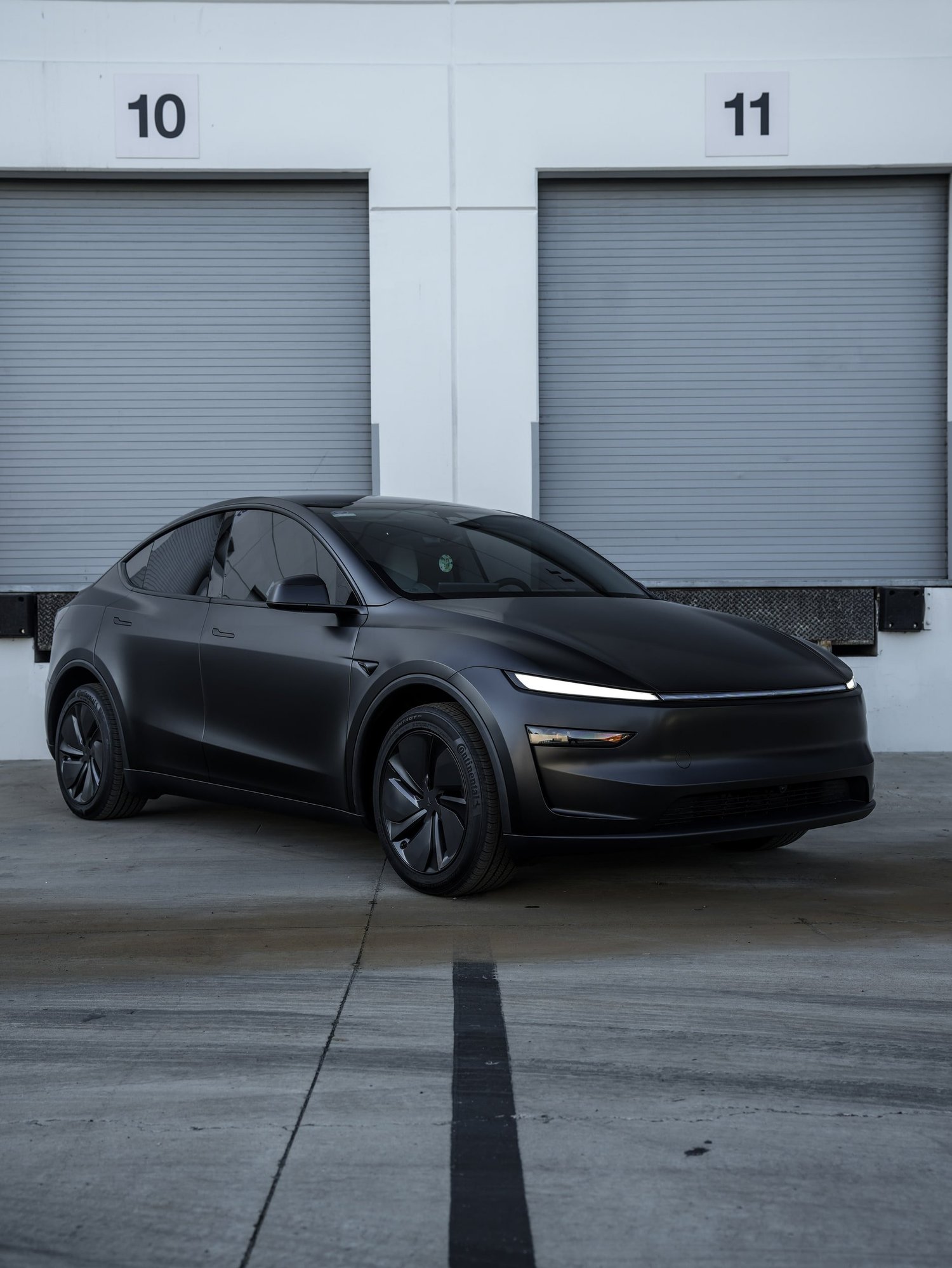 Tesla Model Y 3M Satin Black after Vinyl Wrap, front-left three-quarter view