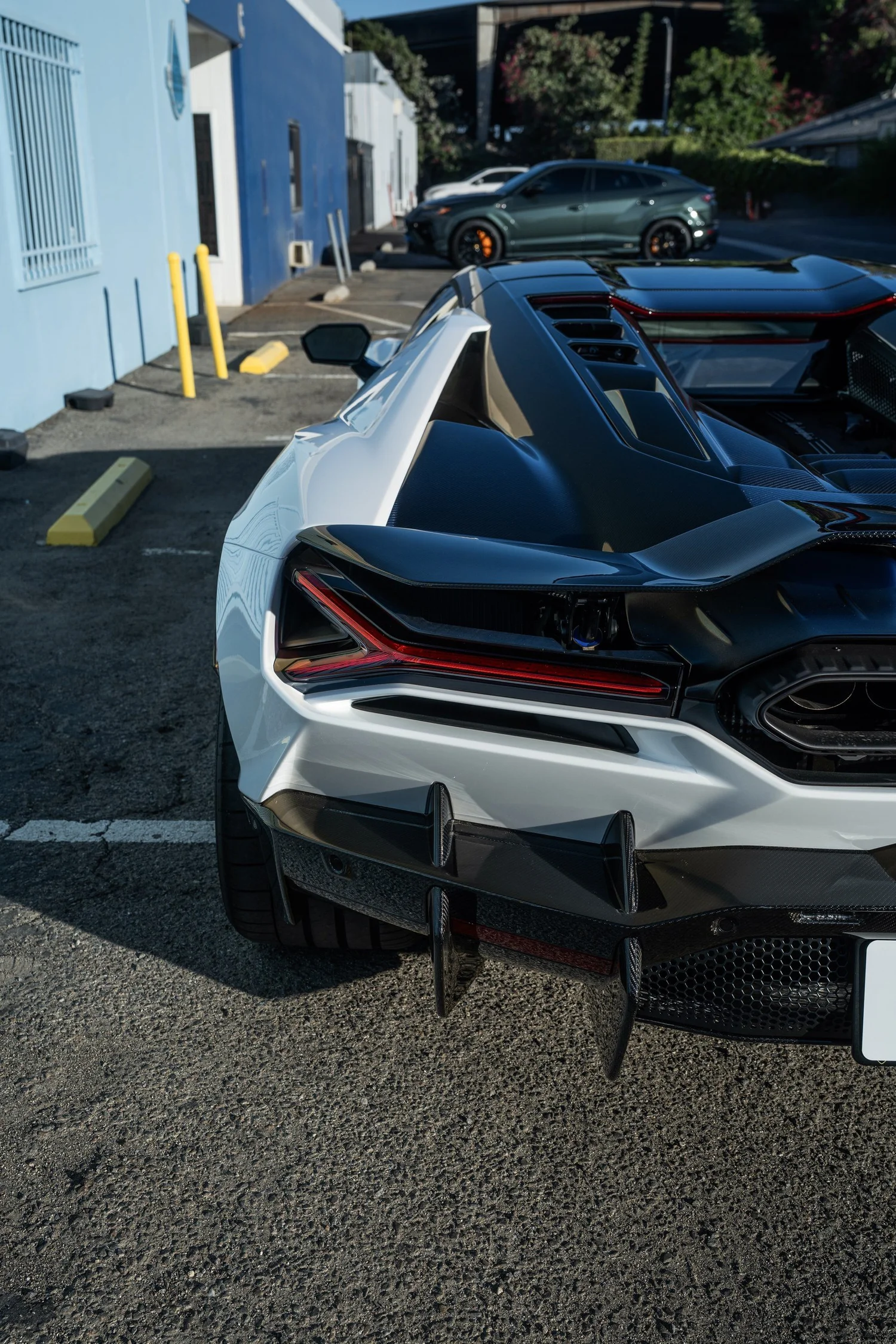 Revuelto rear-quarter detail showing the tail lamp, carbon aero and rear wheel.