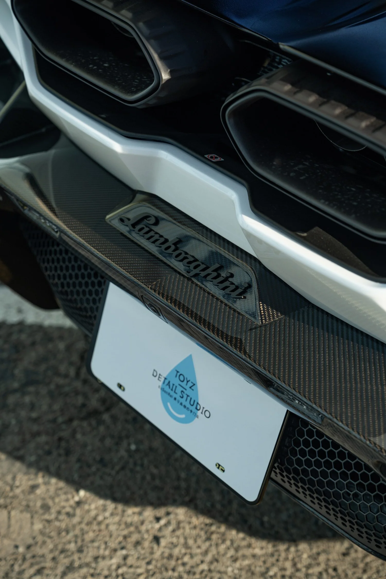 Revuelto twin exhaust outlets and Lamborghini script above the rear diffuser.