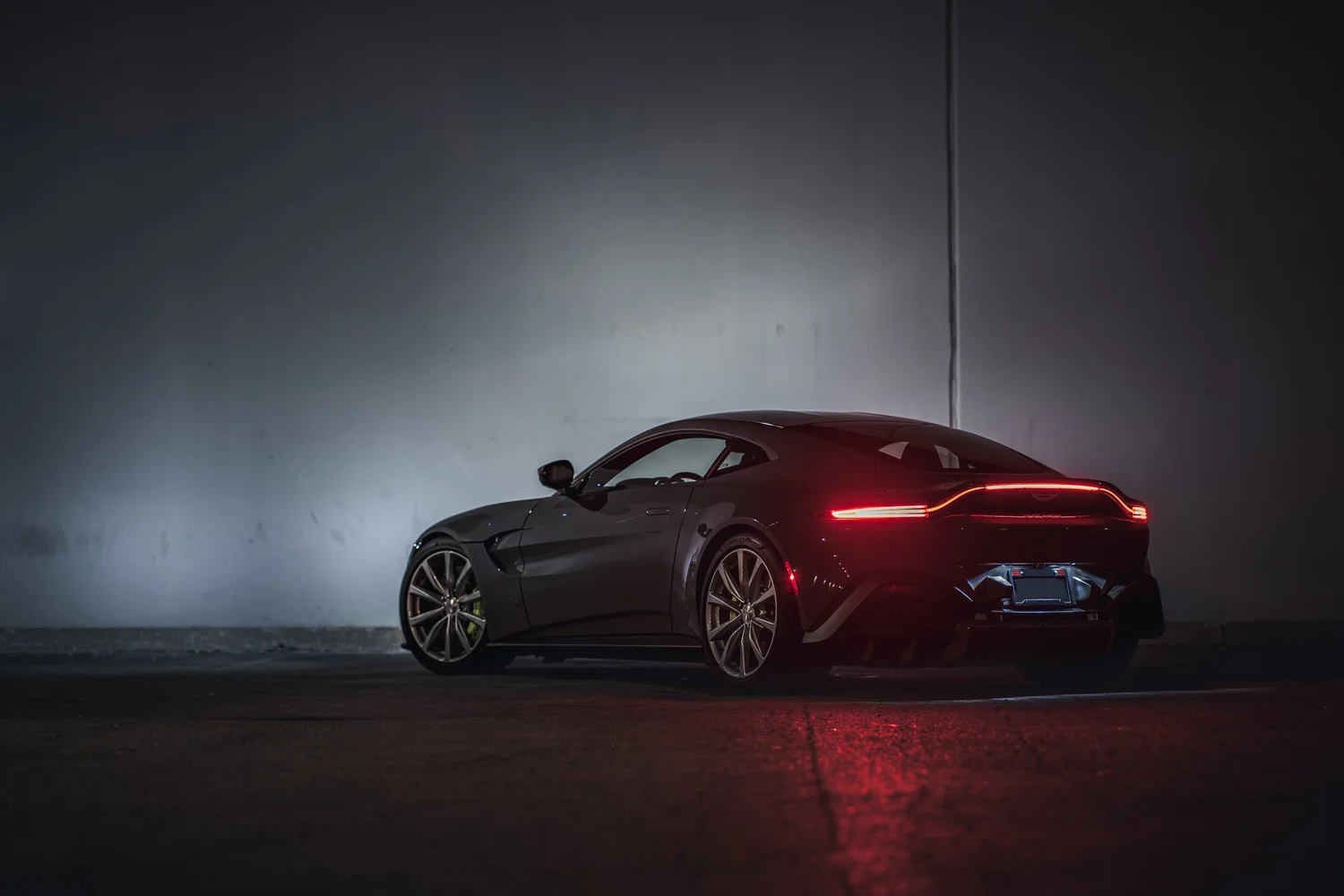 Aston Martin Vantage Acid Green after Brake Caliper Repaint, low-angle rear view