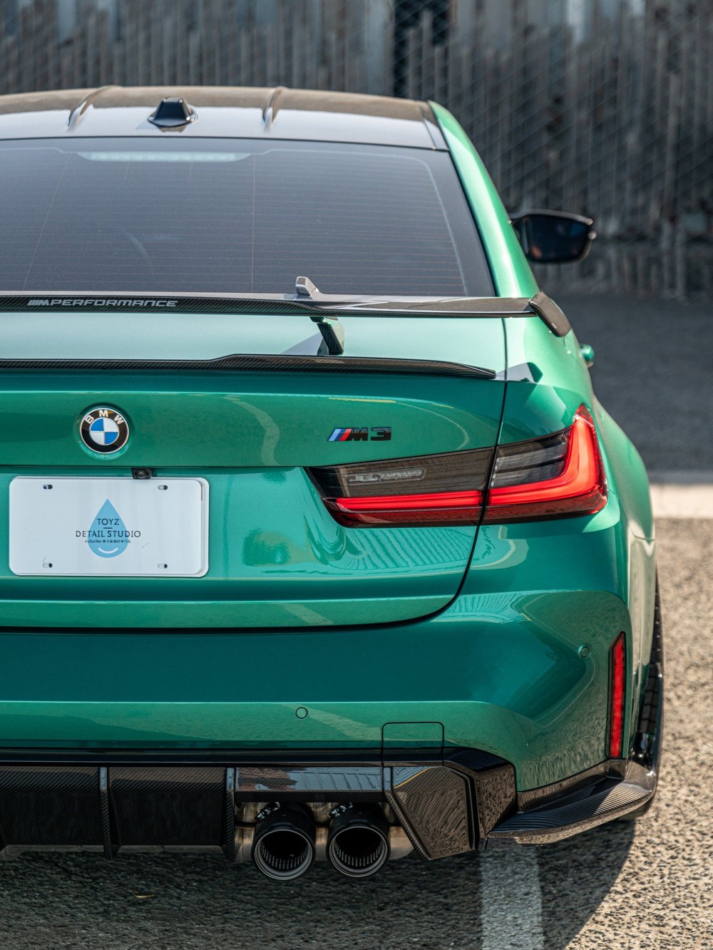 Rear corner of the BMW M3 showing the carbon wing, rear diffuser and lower bumper aero