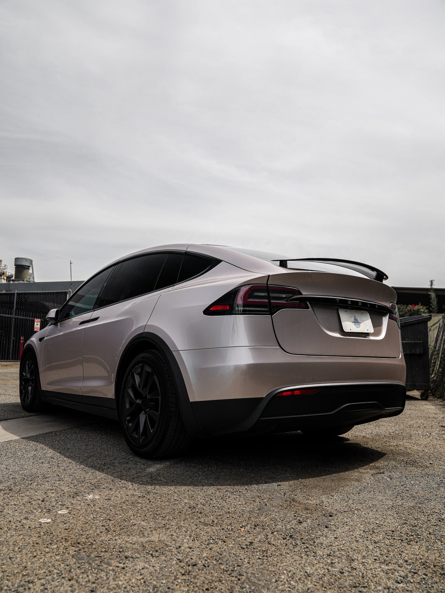 Tesla Model X Champagne Gold after Vinyl Wrap, rear-right three-quarter view