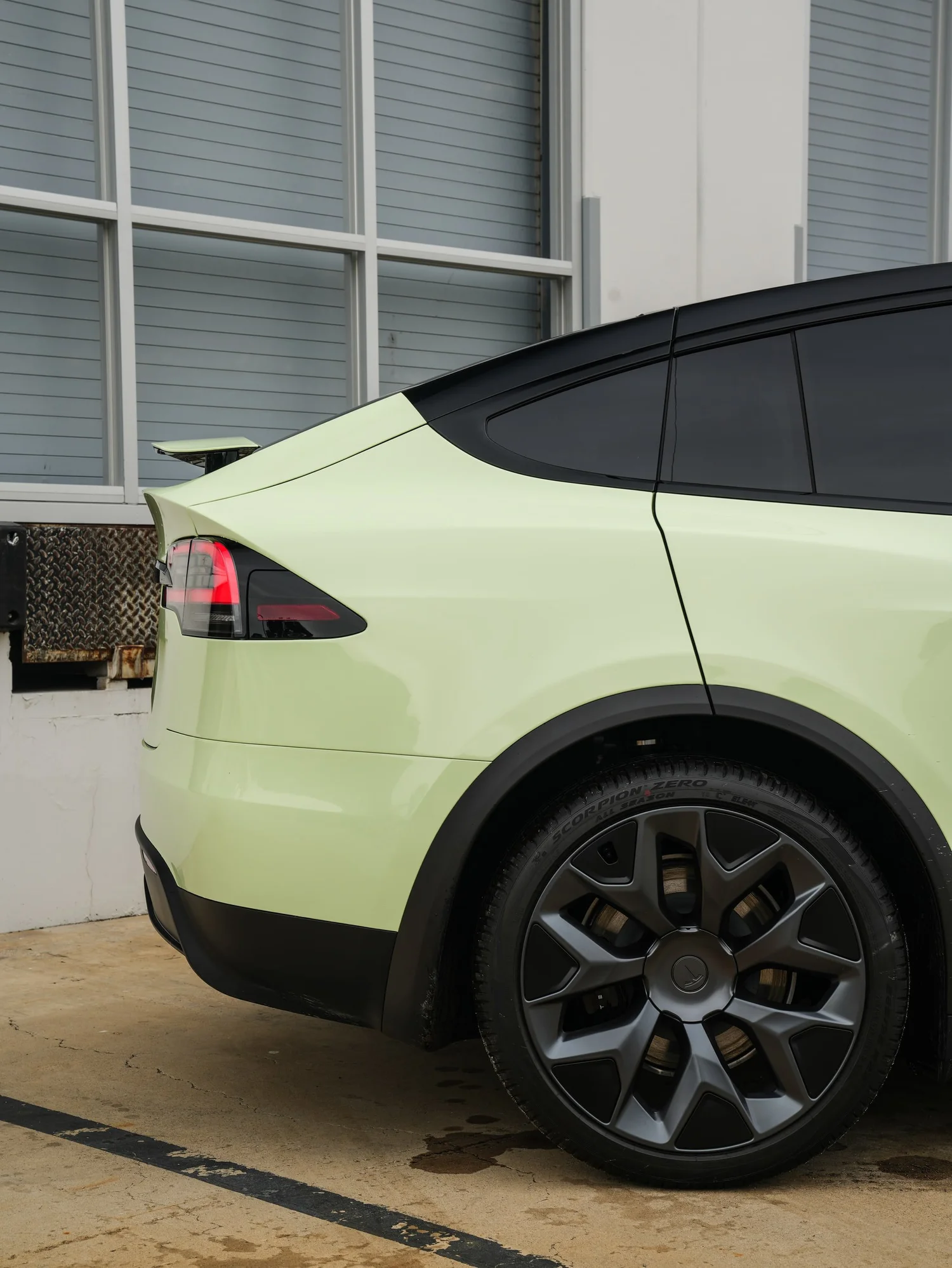 Tesla Model X Avocado Green after Vinyl Wrap, rear-quarter and wheel view