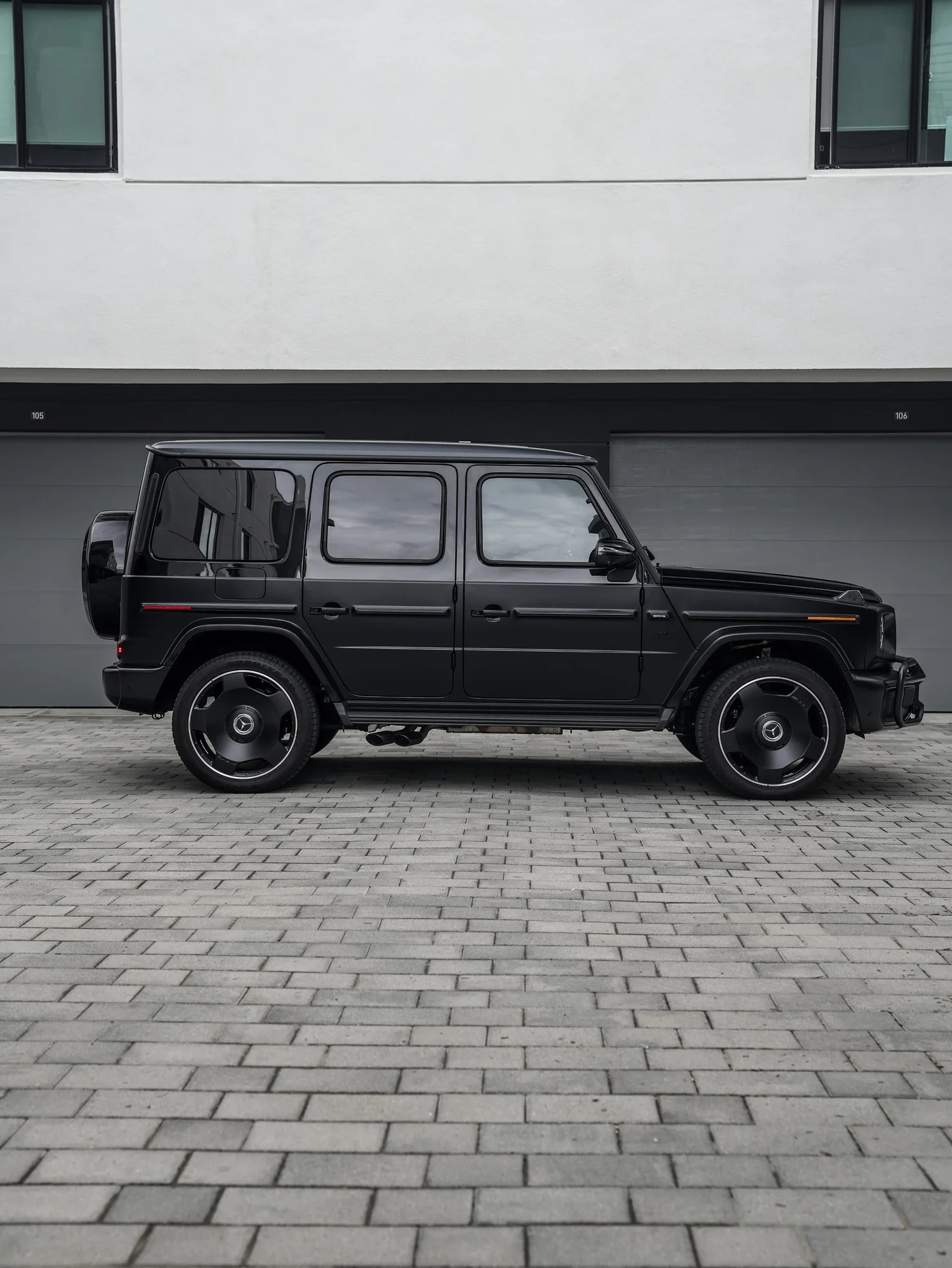 Mercedes-AMG G 63 Two-Tone Black after Paint Protection Film (PPF) and Window Tint, rear-left three-quarter view