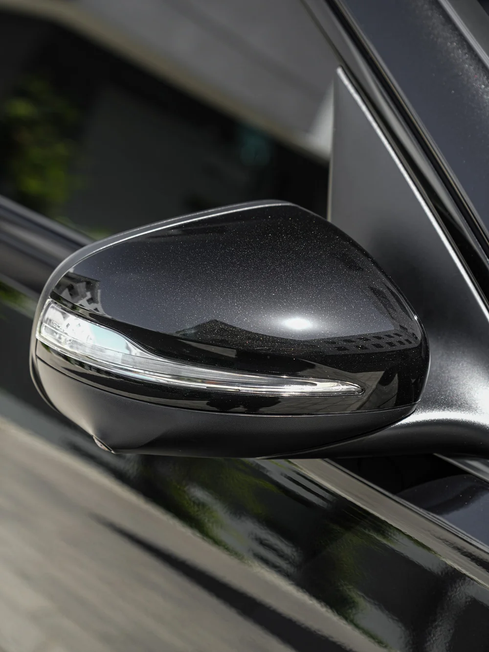 Mercedes-AMG GLS 63 side mirror and indicator beside the dark side window