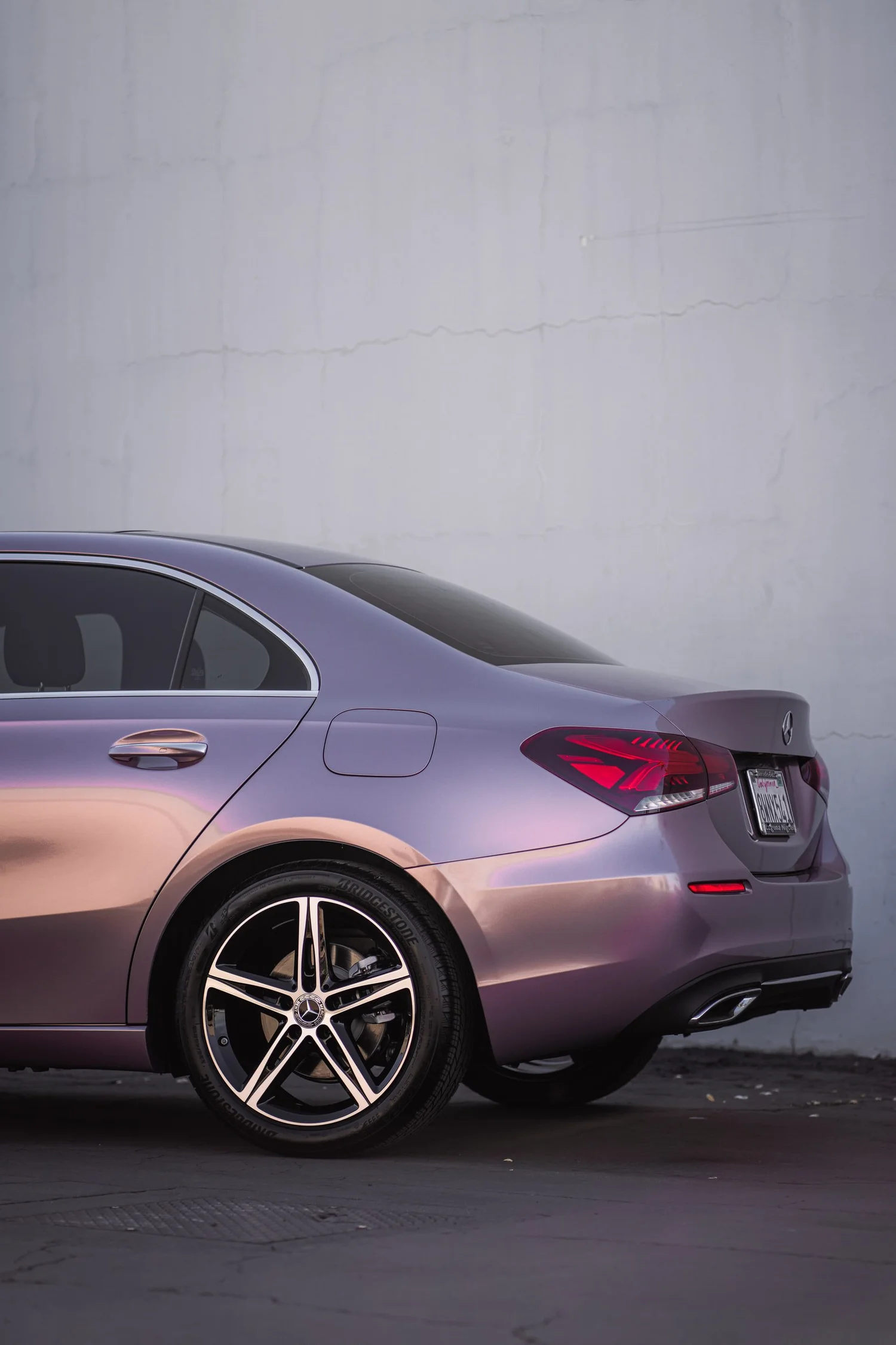 Mercedes-Benz A 220 Frozen Berry after Vinyl Wrap, rear-left three-quarter view
