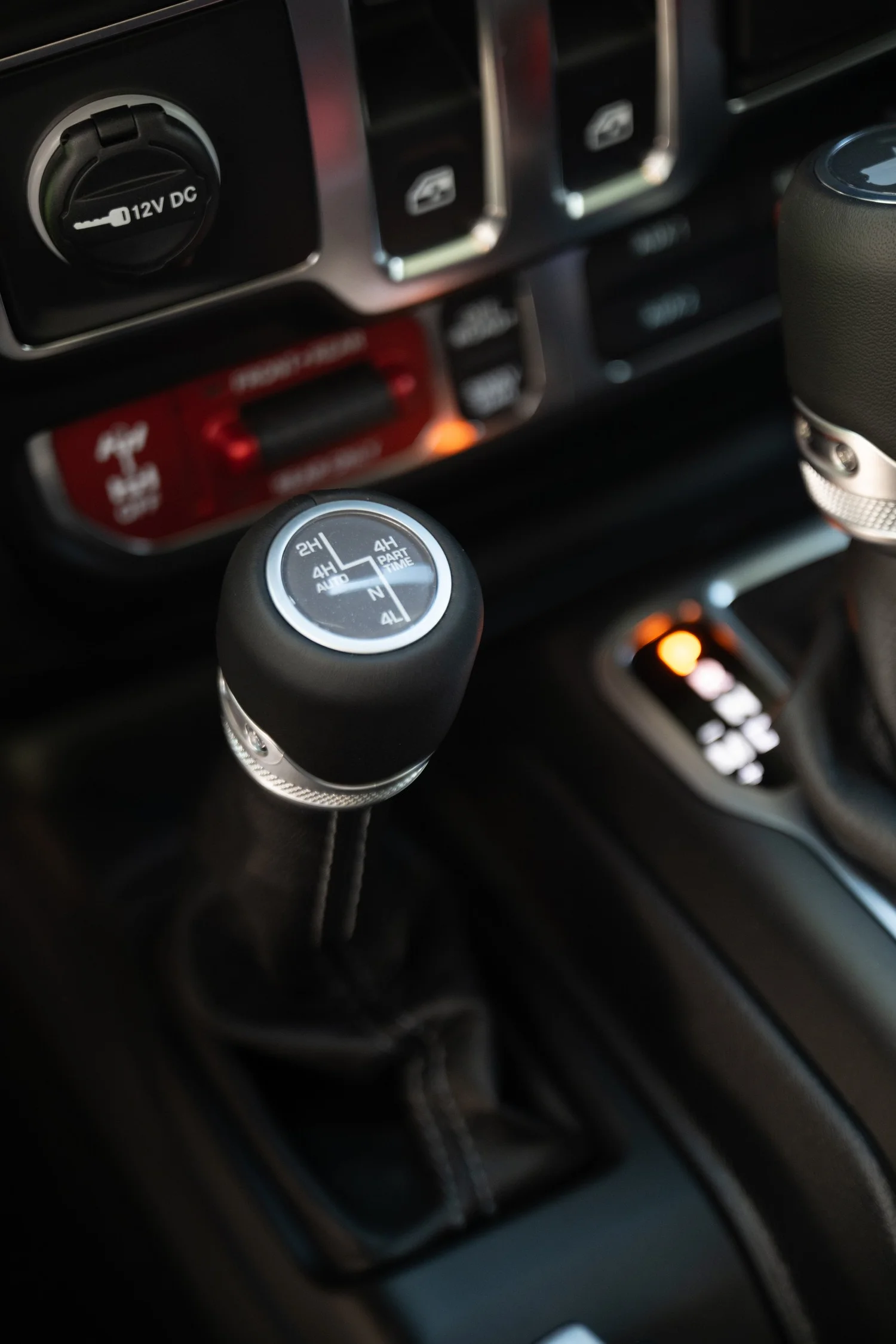 Four-wheel-drive transfer-case selector and drive-mode markings on the Wrangler Rubicon center console
