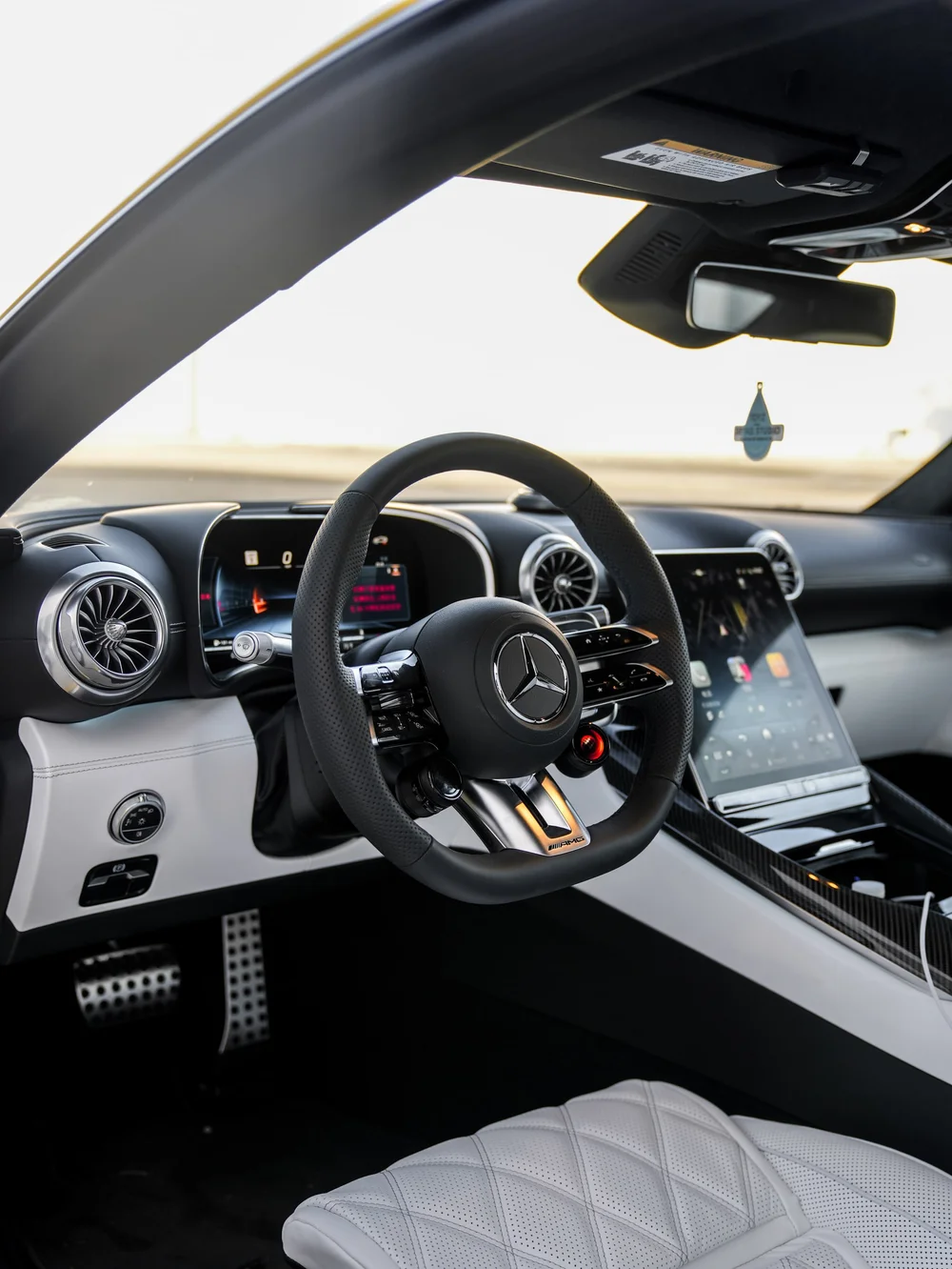 GT 63 steering wheel, instrument display and pale quilted seat