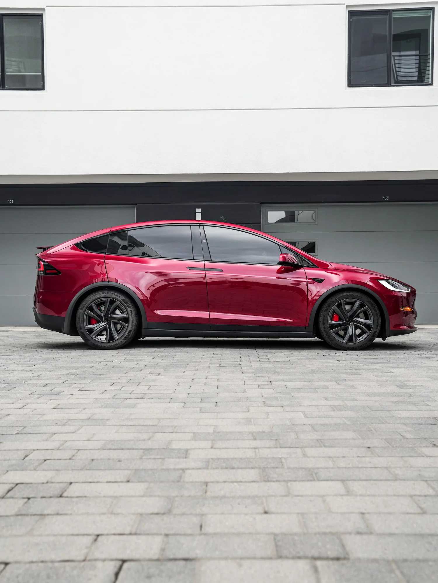 Tesla Model X after Paint Protection Film (PPF) and Window Tint, rear-left three-quarter view
