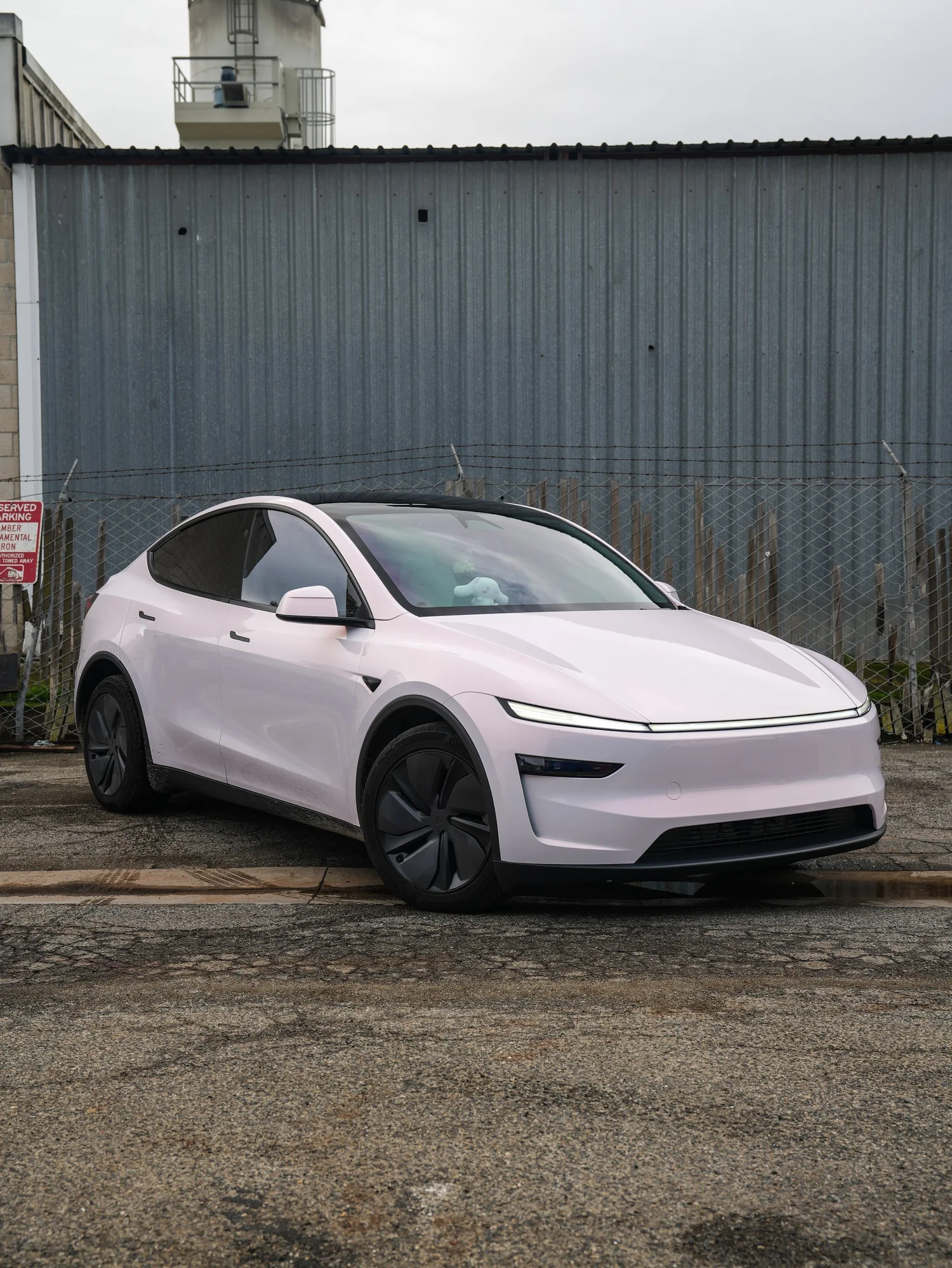 Pale Blush Pink Tesla Model Y after Vinyl Wrap, front-left three-quarter view