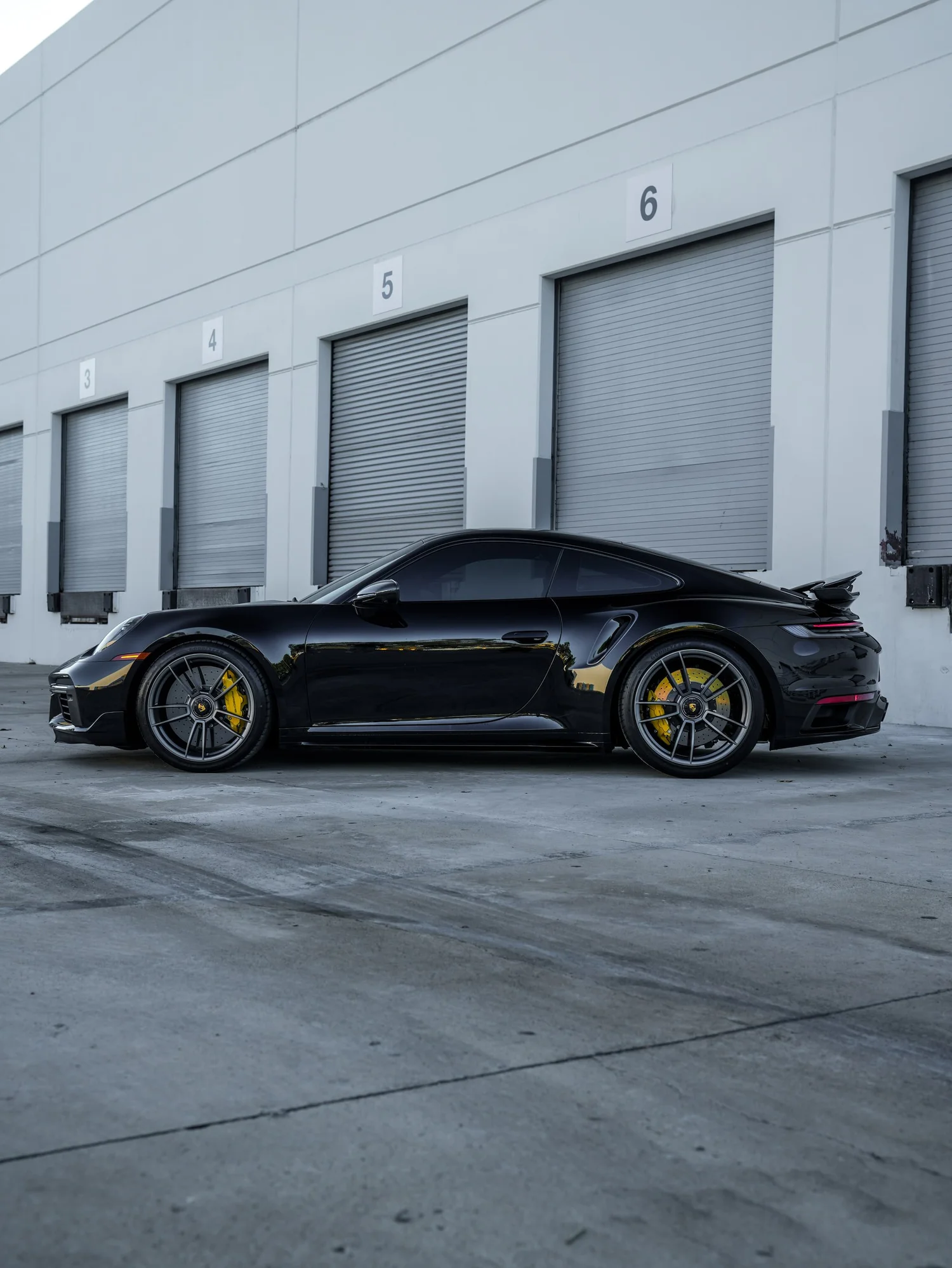Porsche 911 Turbo S after Paint Protection Film (PPF), Window Tint and Ceramic Coating, rear-left three-quarter view