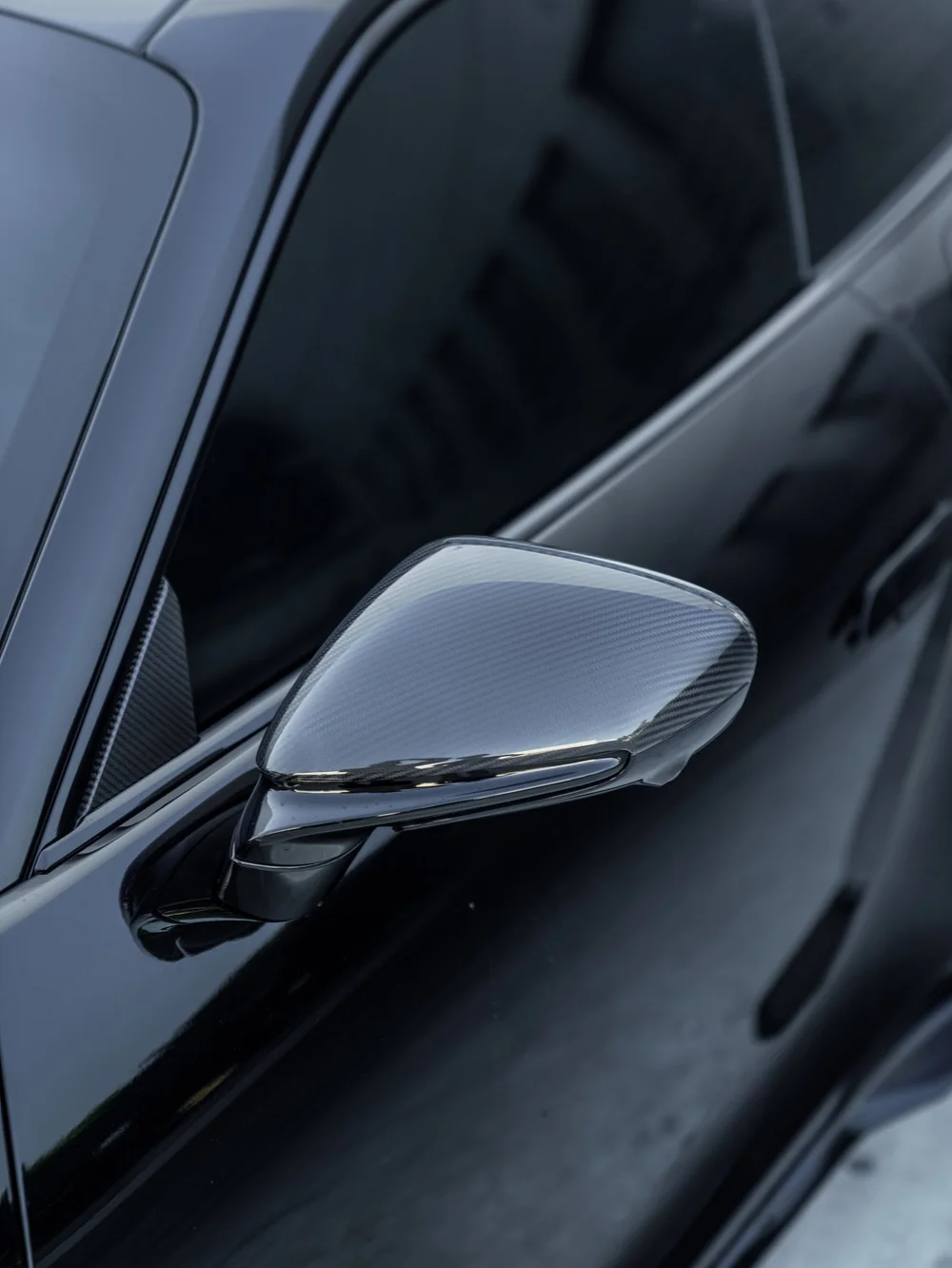 Porsche 911 Turbo S side mirror beside the dark side window from this window tint project