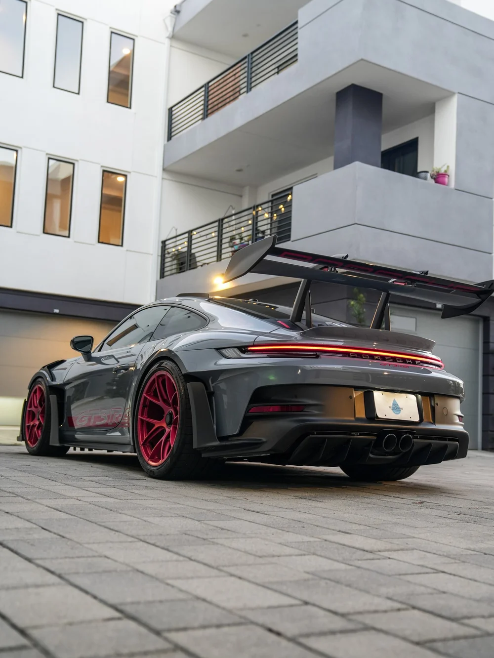 Low full rear three-quarter view in the courtyard — Porsche 911 GT3 RS detailing project