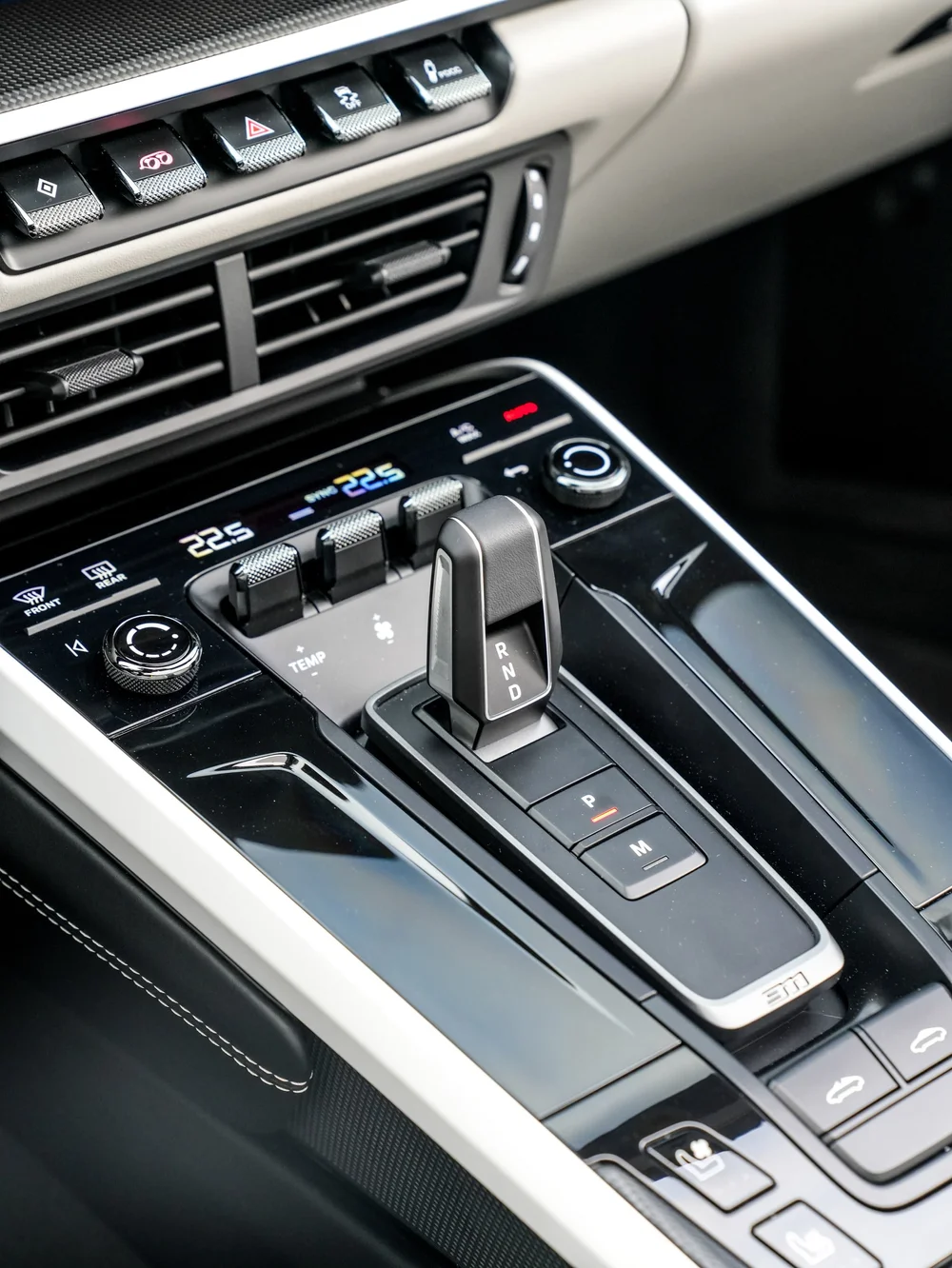 Porsche center console with gear selector, climate controls and dashboard vents