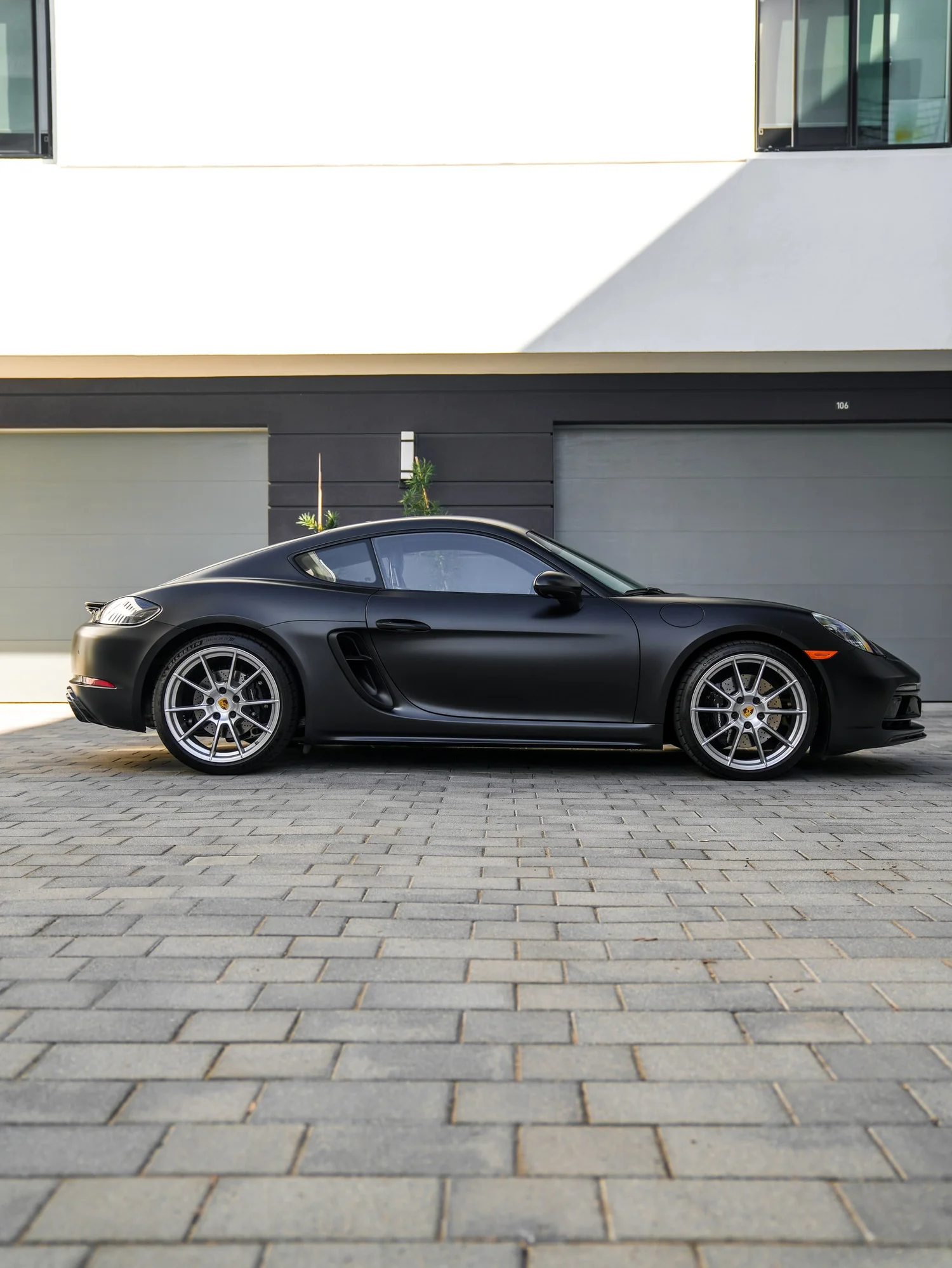 Porsche 718 Cayman GTS 3M Satin Black after Vinyl Wrap, front-left three-quarter view