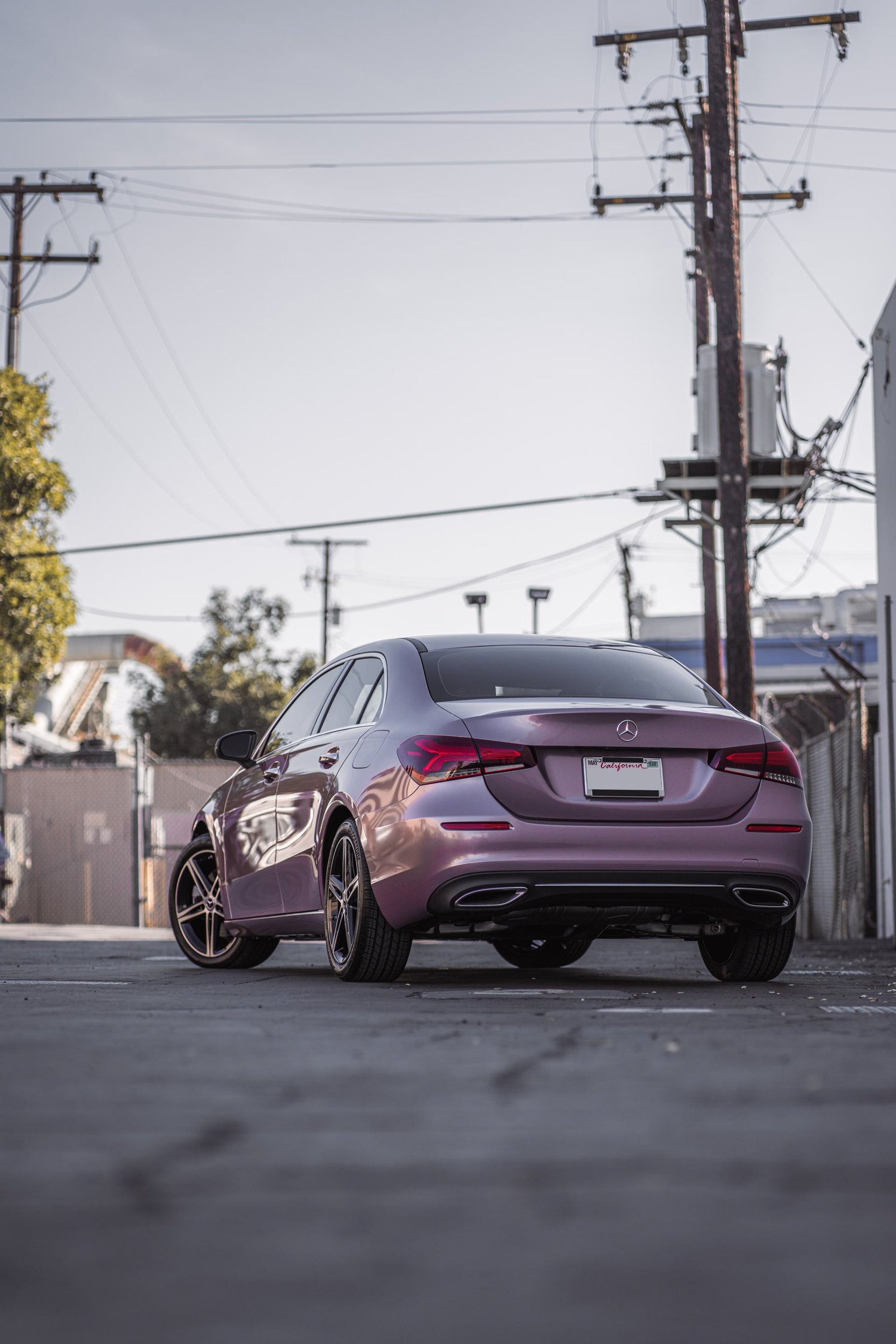 Mercedes-Benz A 220 Frozen Berry after Vinyl Wrap, low-angle rear view