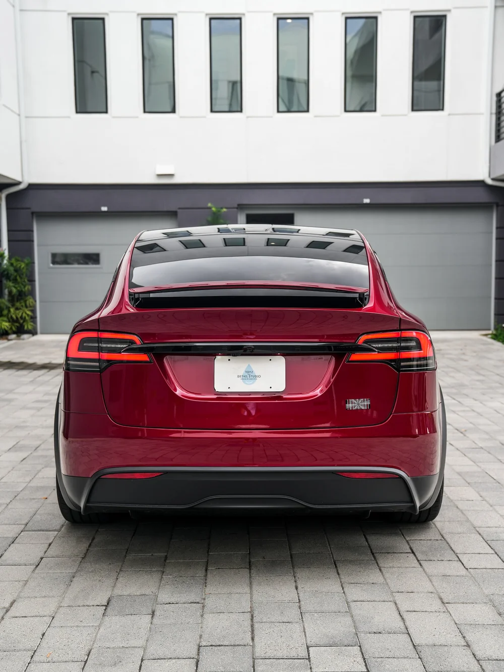 Tesla Model X PPF and XR Plus tint project, direct rear view with tailgate and taillights