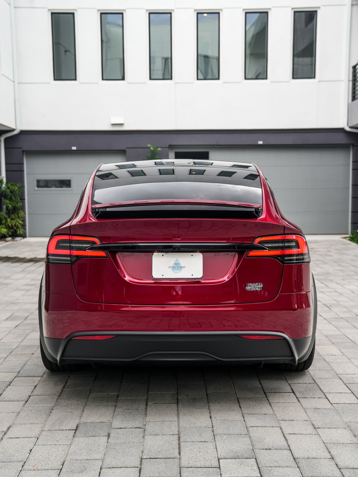 Tesla Model X after Paint Protection Film (PPF) and Window Tint, rear body and taillight view