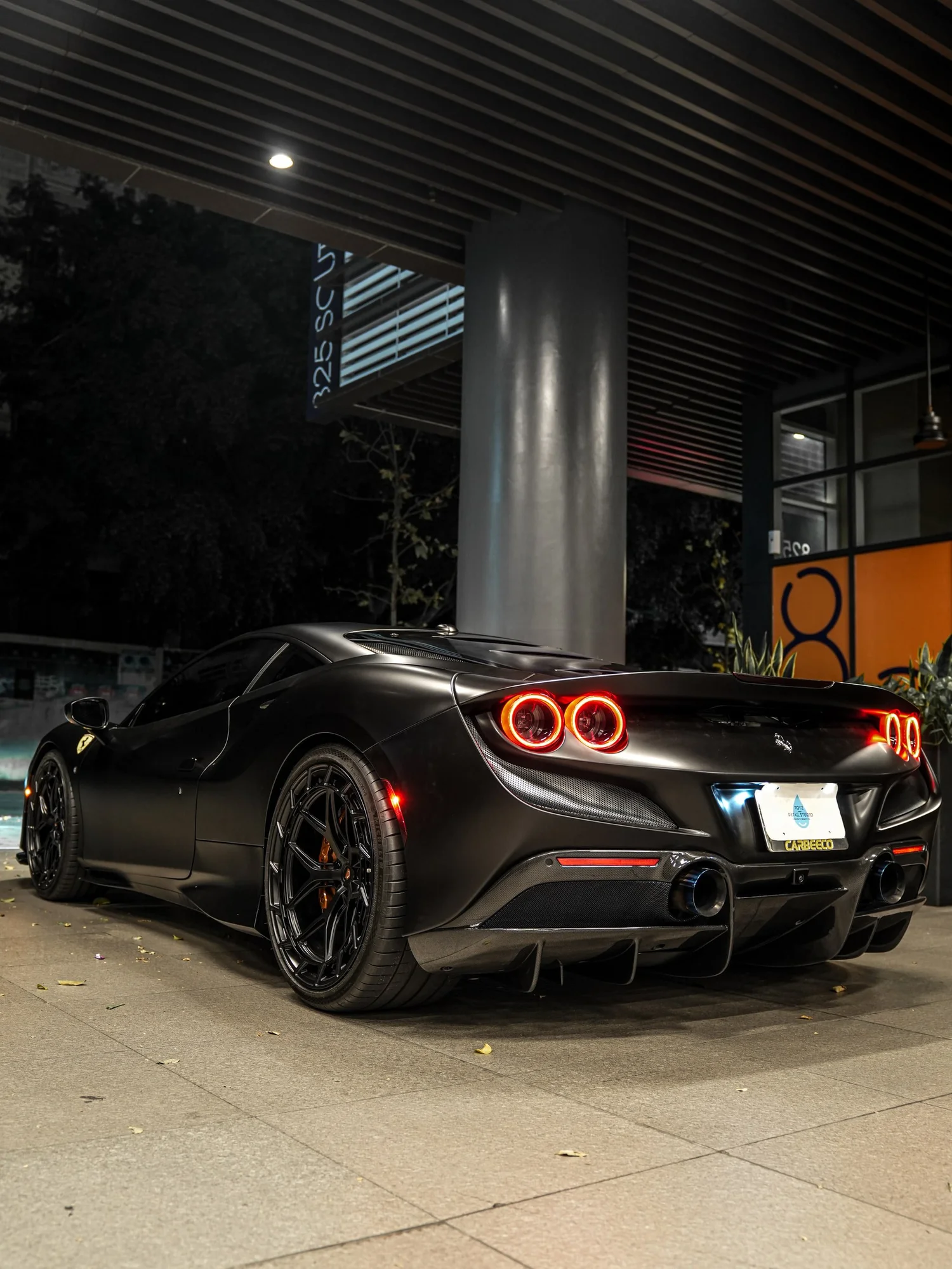 Ferrari F8 3M Satin Black after Vinyl Wrap, rear-right three-quarter view