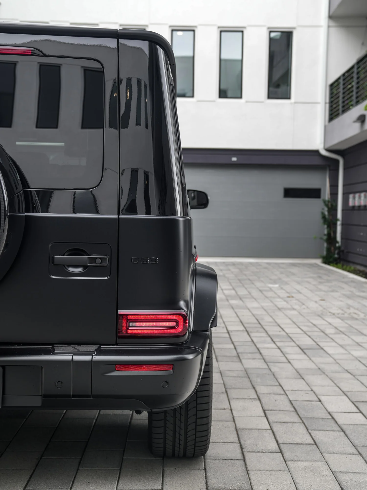 Mercedes-AMG G 63 Two-Tone Black after Paint Protection Film (PPF) and Window Tint, rear body and taillight view