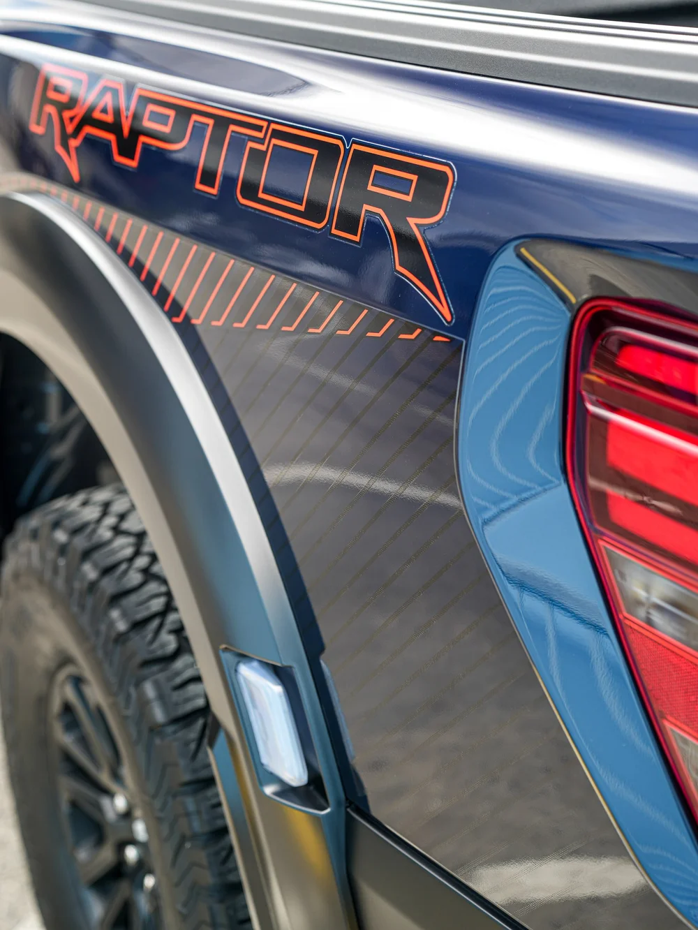 Dark Blue Ford F-150 Raptor, raptor graphic and rear bed-side close-up