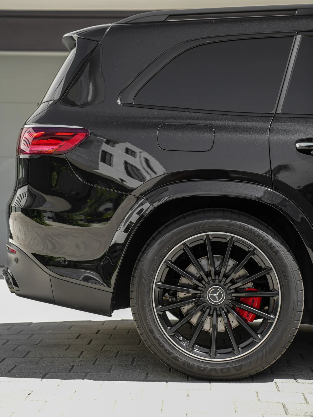 Mercedes-AMG GLS 63 rear wheel and quarter panel beneath the dark rear side glass
