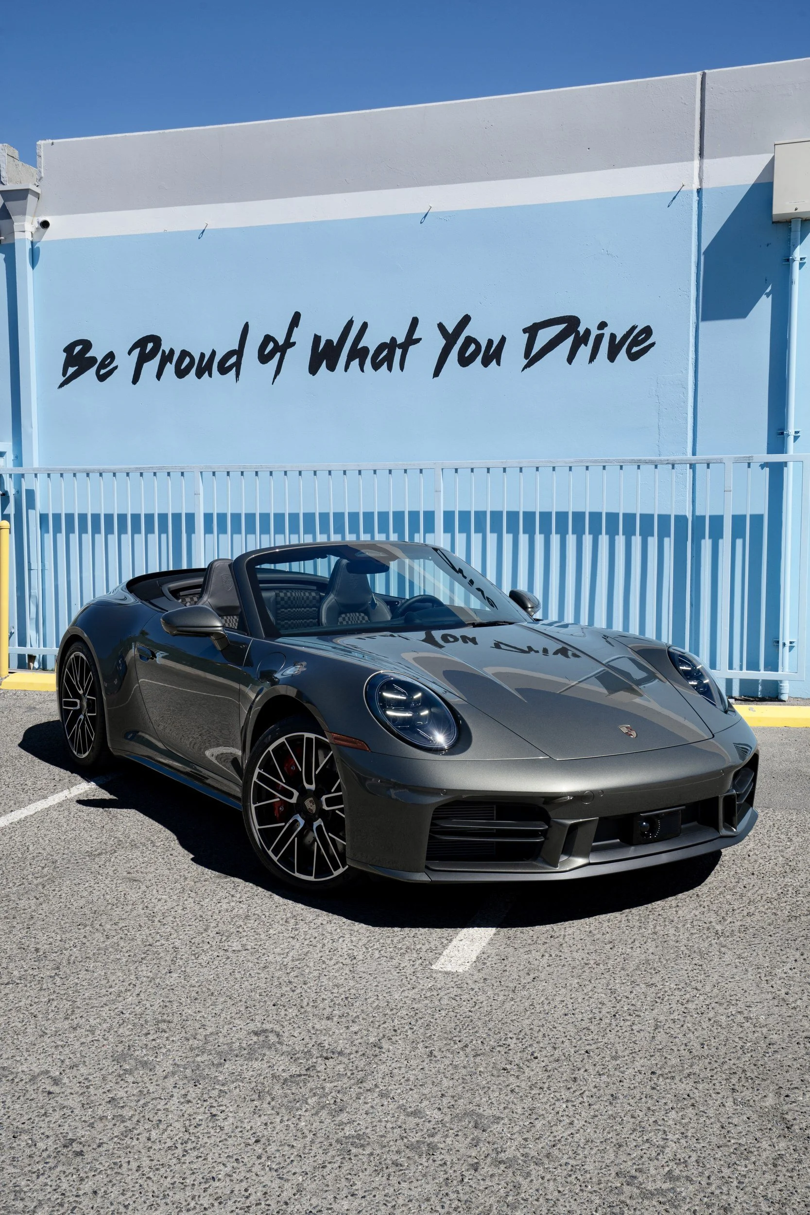 Complete front three-quarter view of the Vanadium Grey Metallic 2026 Porsche 911 Carrera 4S Cabriolet at Toyz Detail Studio in Irvine.