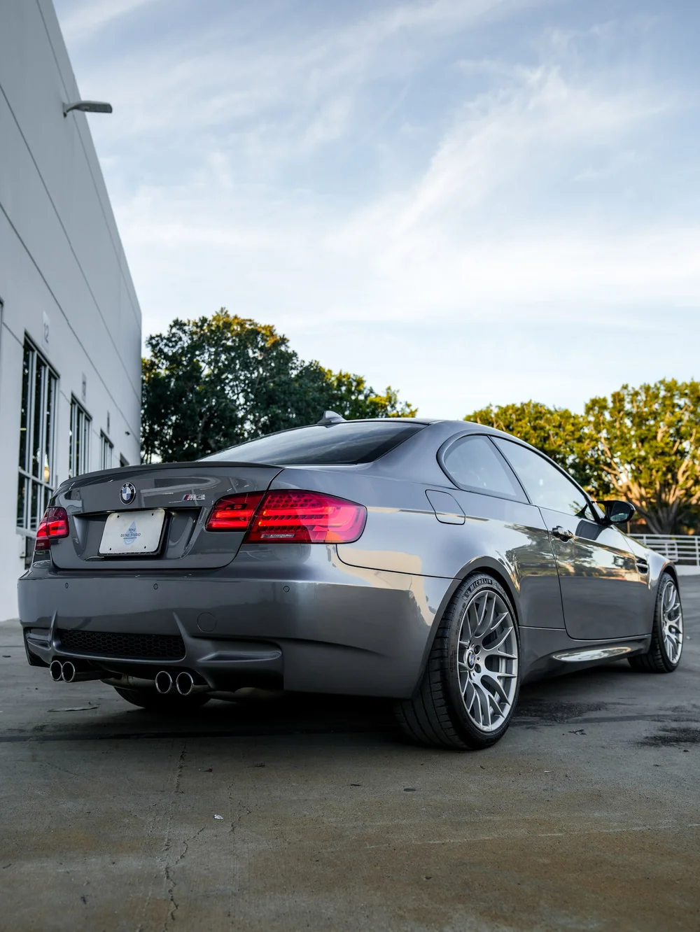 BMW E92 M3 paint protection film project, low rear three-quarter whole-car view