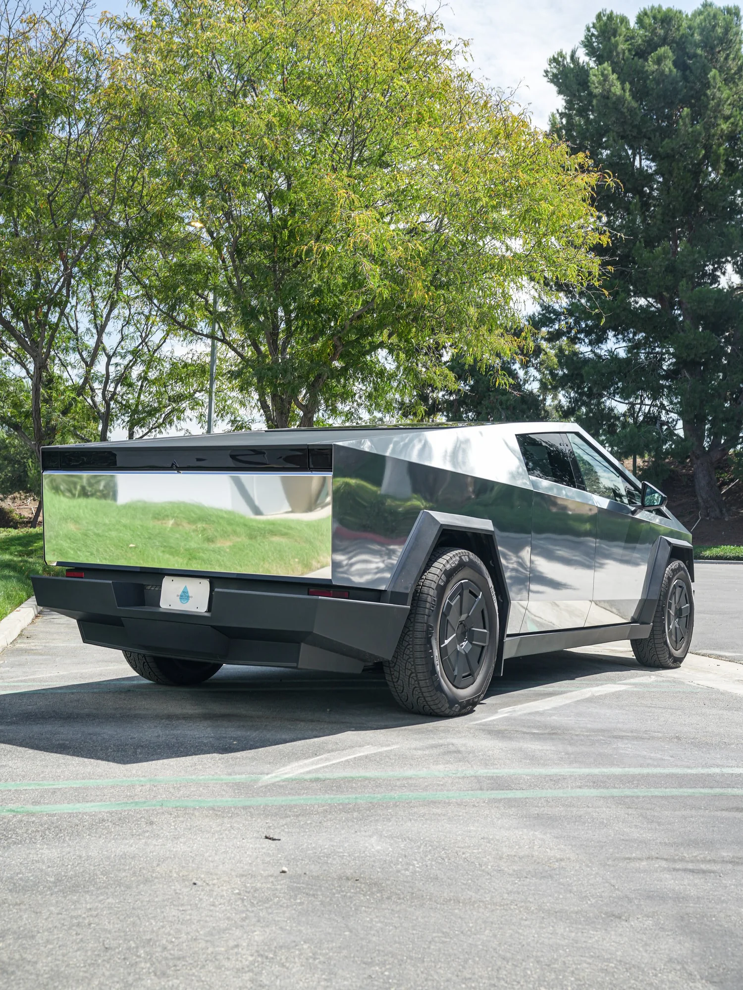 Tesla Cybertruck Chrome after Vinyl Wrap, rear-right three-quarter view
