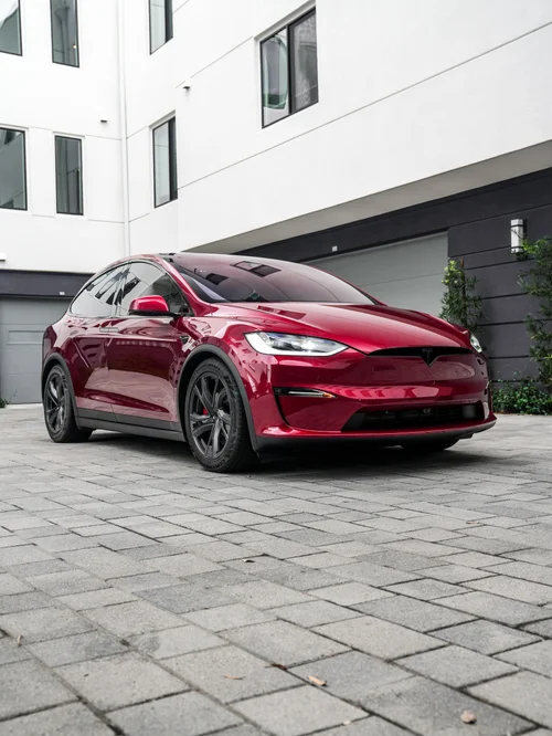 Tesla Model X PPF and XR Plus tint project, complete front three-quarter view outside the studio