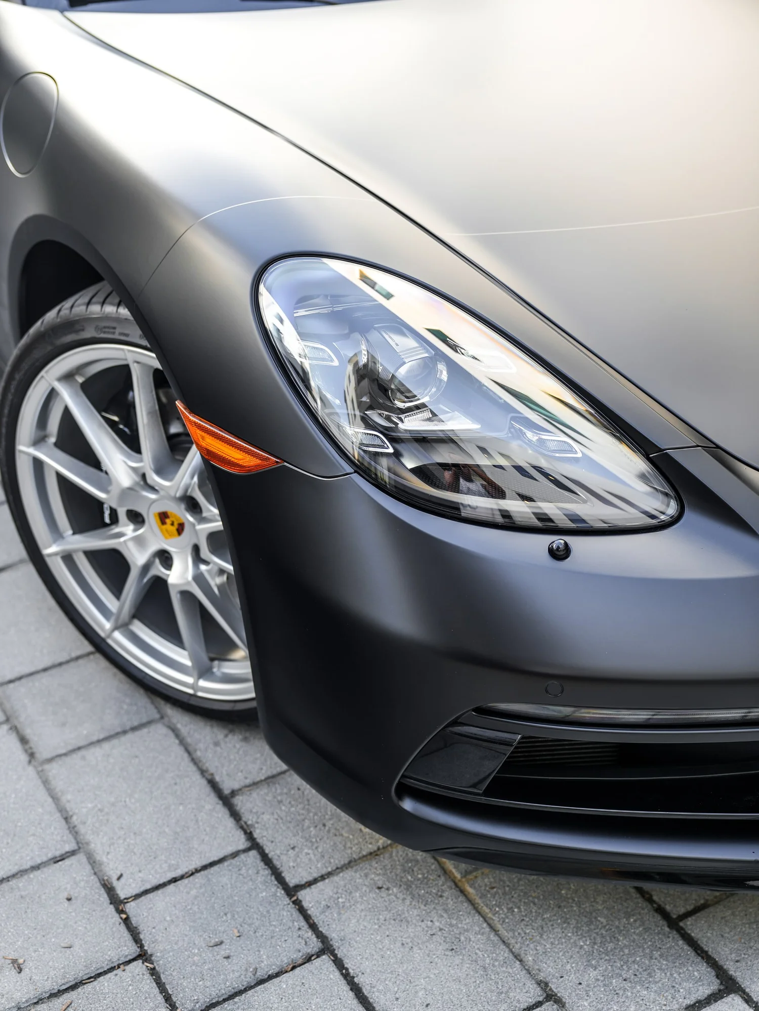 Porsche 718 Cayman GTS 3M Satin Black after Vinyl Wrap, front-corner view