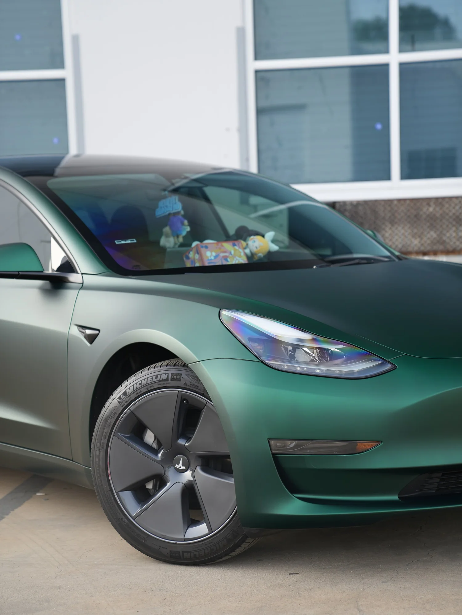 Tesla Model 3 Ghost Matte Green after Vinyl Wrap, front-right three-quarter view