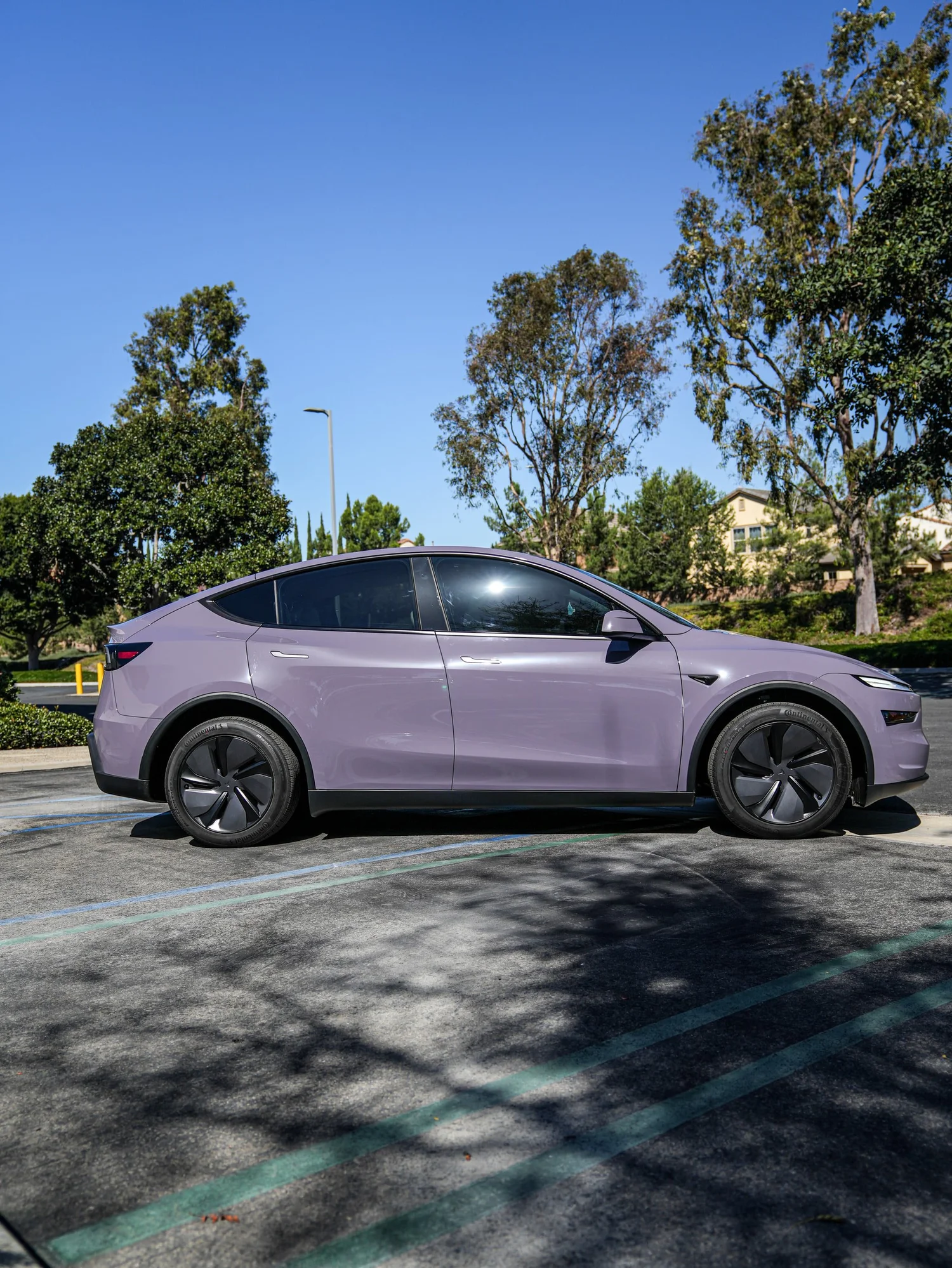 Tesla Model Y Provence Violet after Vinyl Wrap, wide outdoor view