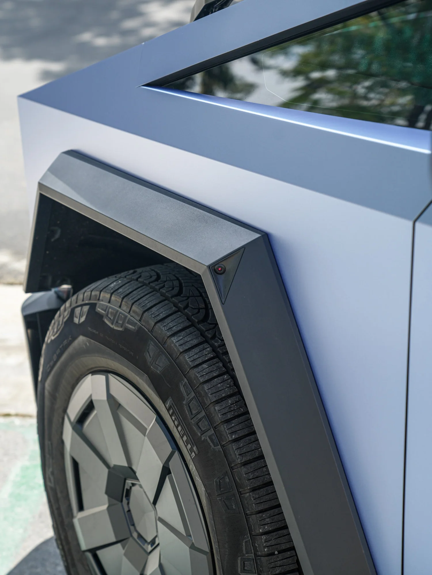 Tesla Cybertruck Matte Blue after Vinyl Wrap, rear-quarter and wheel view