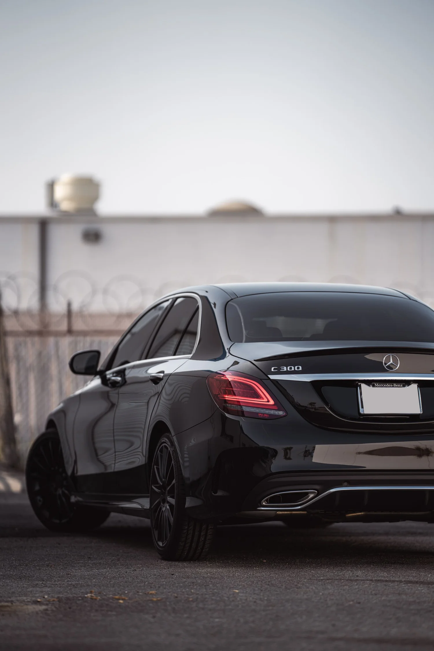 Mercedes-Benz C 300 after Window Tint, Ceramic Coating and Wheel Powder Coating, rear-right three-quarter view