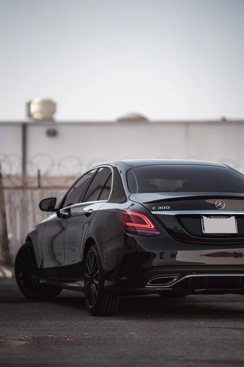 Mercedes-Benz C 300 in a rear three-quarter view with the side and rear windows visible