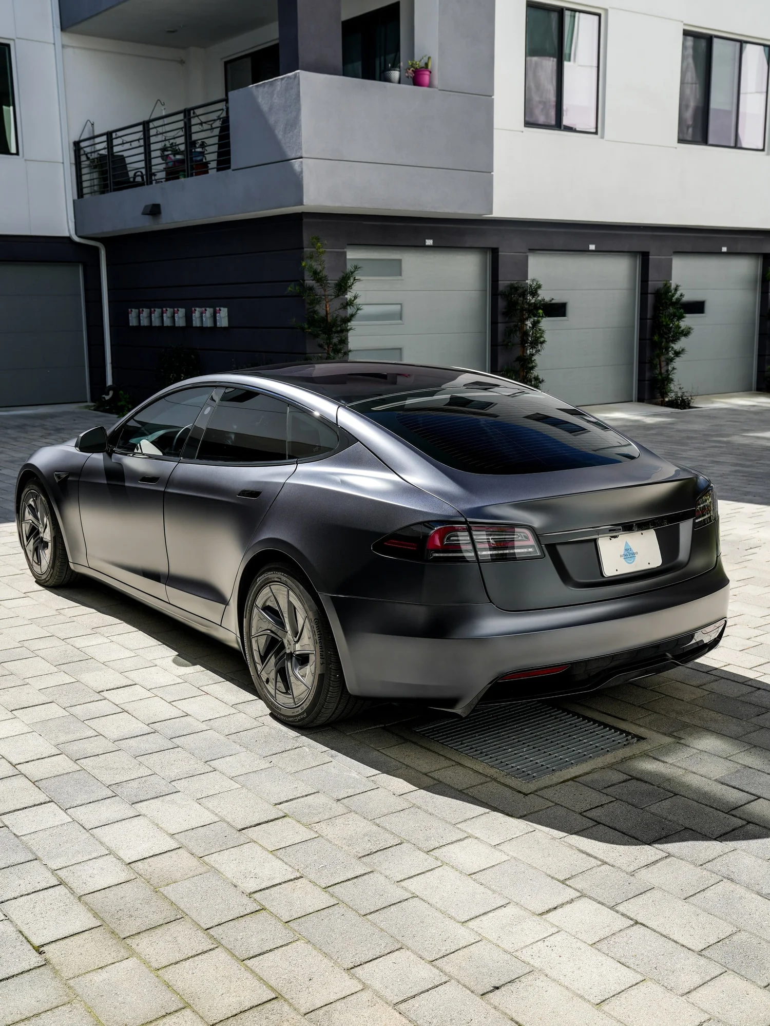 Tesla Model S after Matte PPF and Window Tint, rear-left three-quarter view