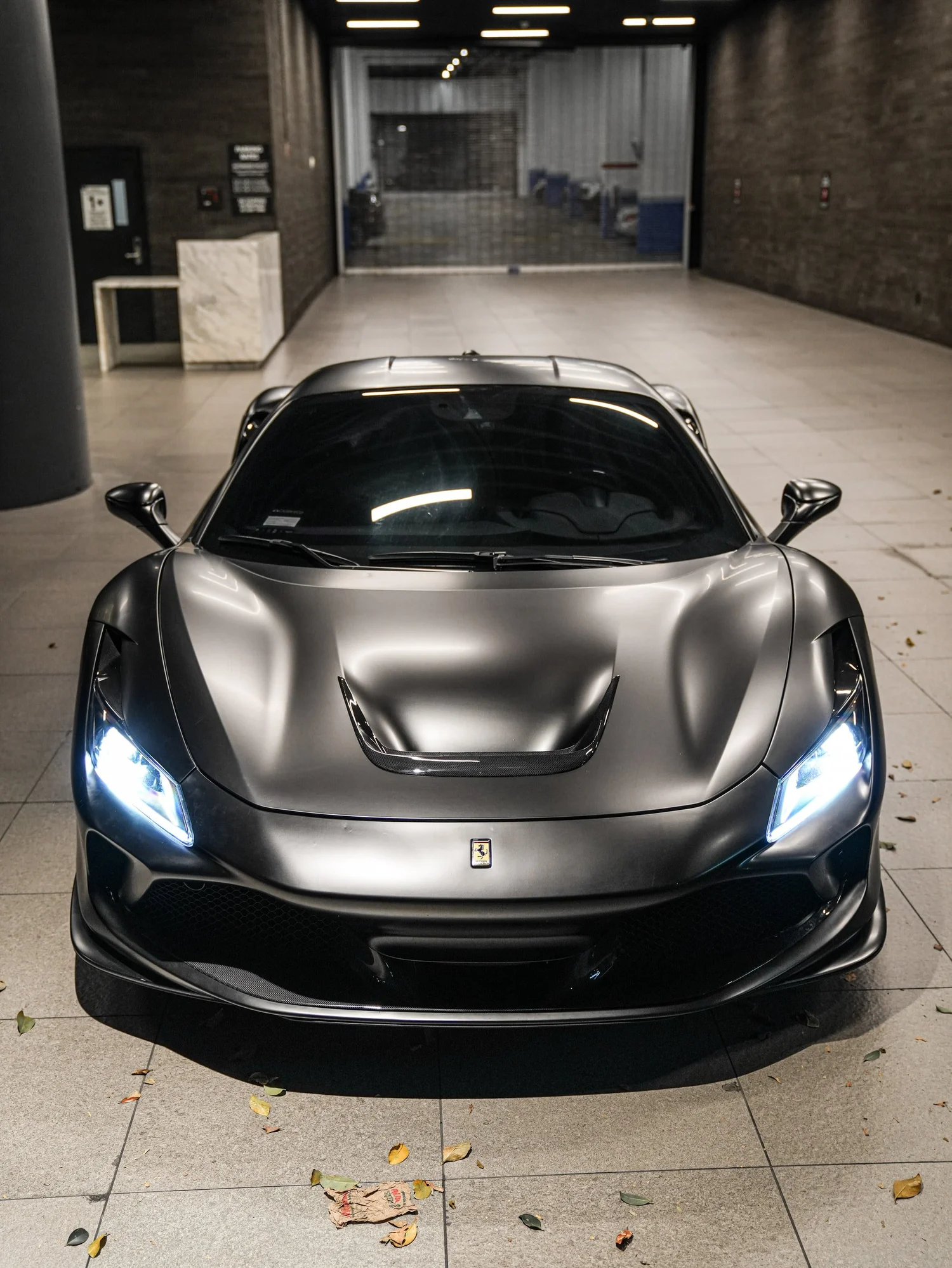 Ferrari F8 3M Satin Black after Vinyl Wrap, low-angle front view