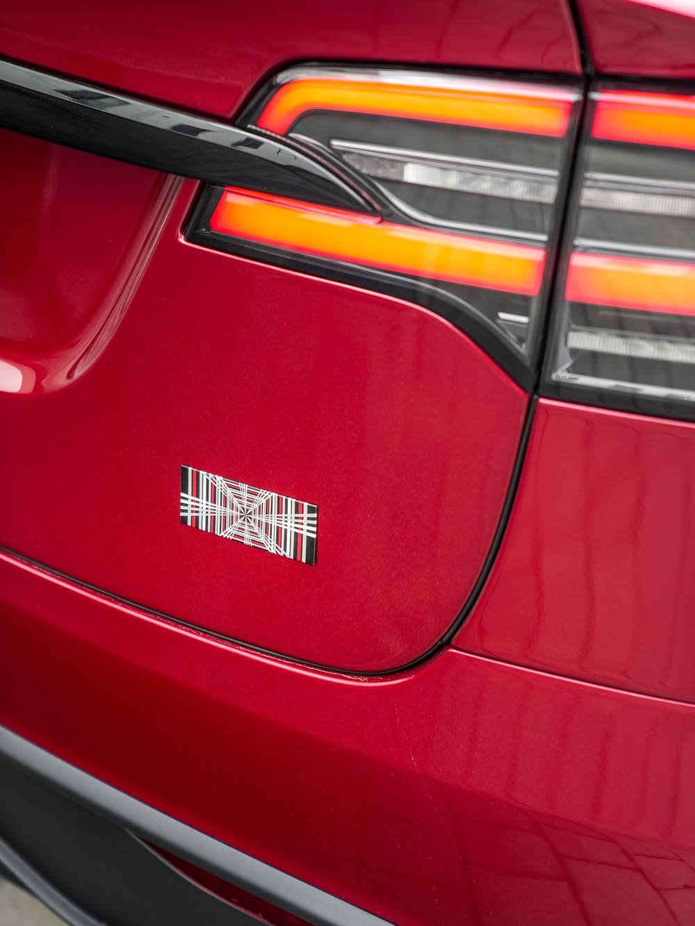 Tesla Model X PPF and XR Plus tint project, taillight and tailgate-badge detail