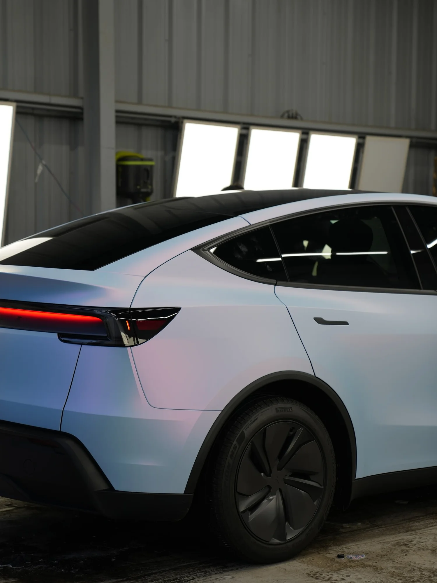 Tesla Model Y Color-Shifting White-to-Blue after Vinyl Wrap, rear body and taillight view