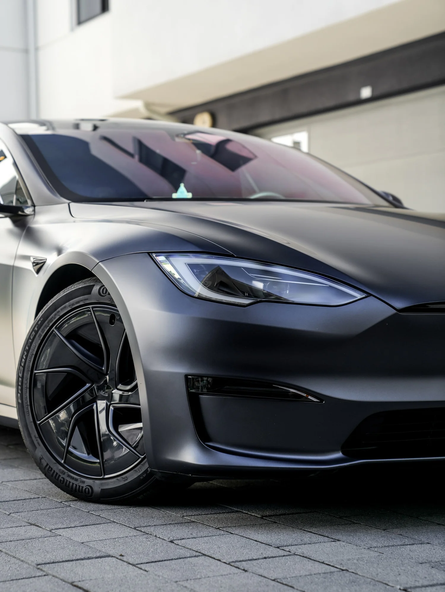 Tesla Model S after Matte PPF and Window Tint, front wheel and body view