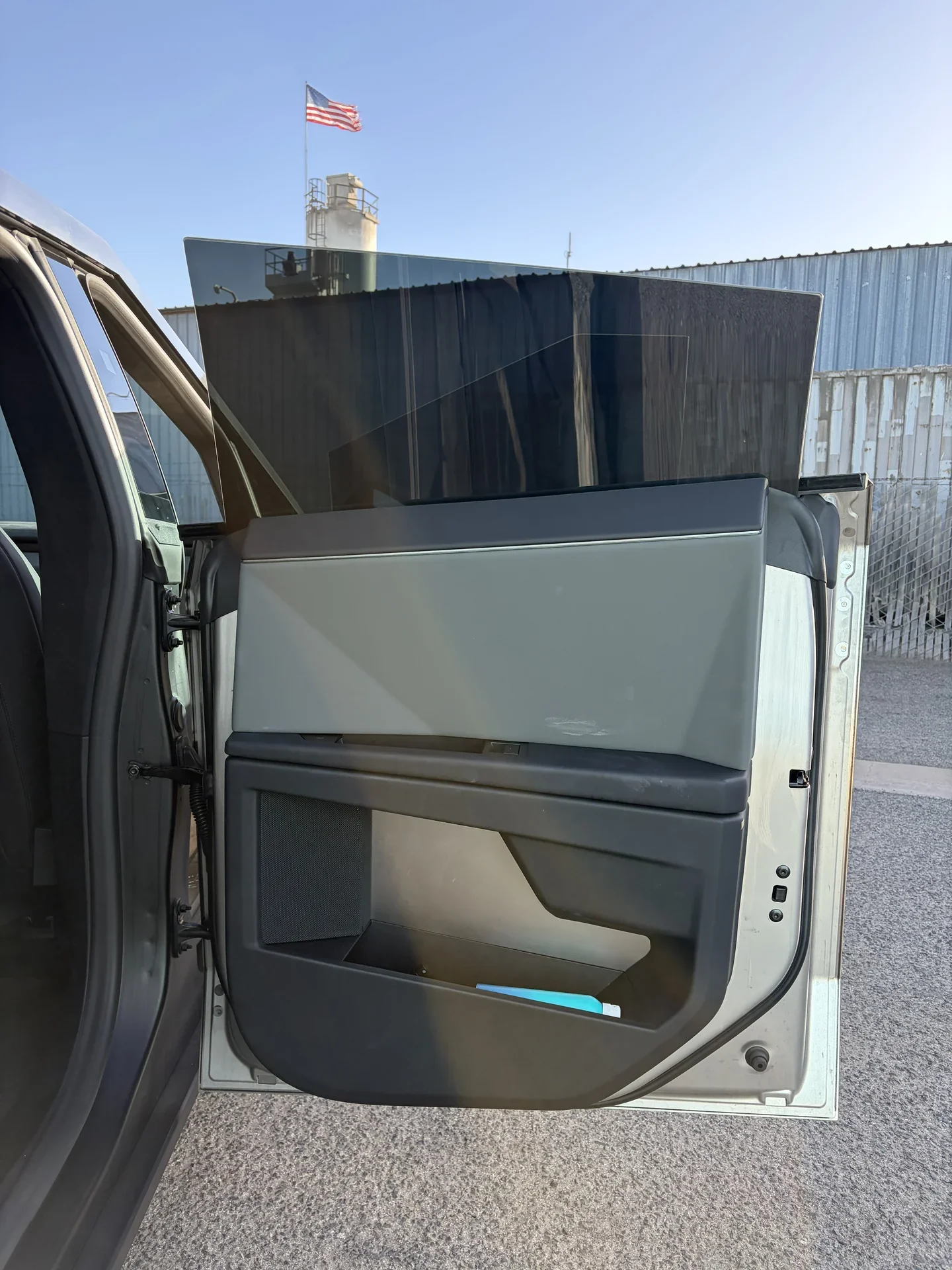 2026 Tesla Cybertruck Cyberbeast — open rear door and side window viewed from outside