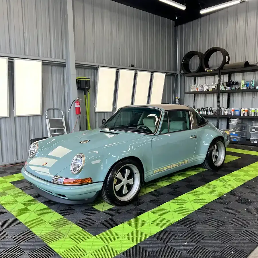 Light blue Porsche Singer 911 Targa inside Toyz Detail Studio in Irvine