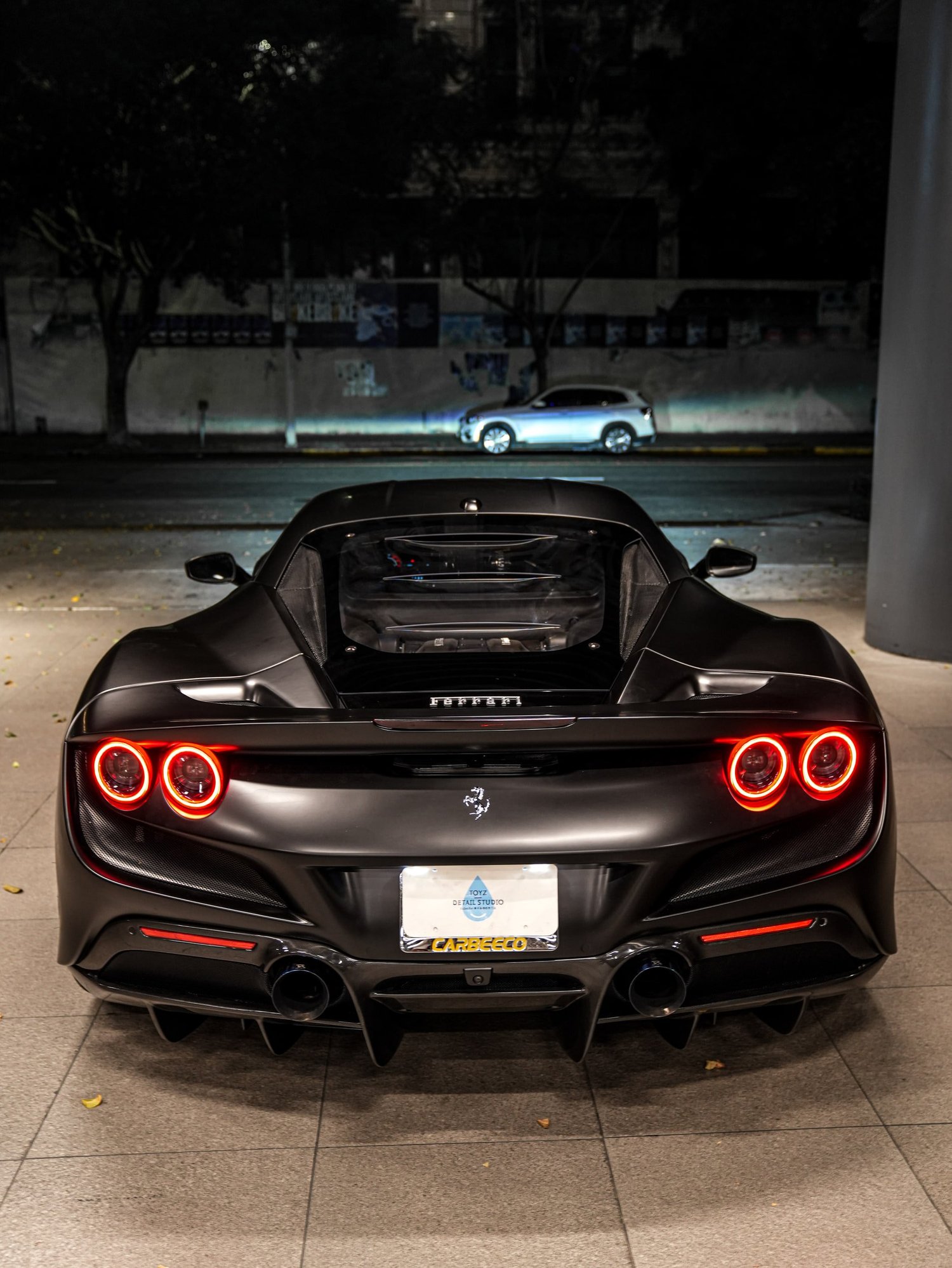 Ferrari F8 3M Satin Black after Vinyl Wrap, low-angle rear view