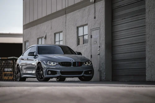 BMW 440i front three-quarter view with the finished Nardo Grey exterior