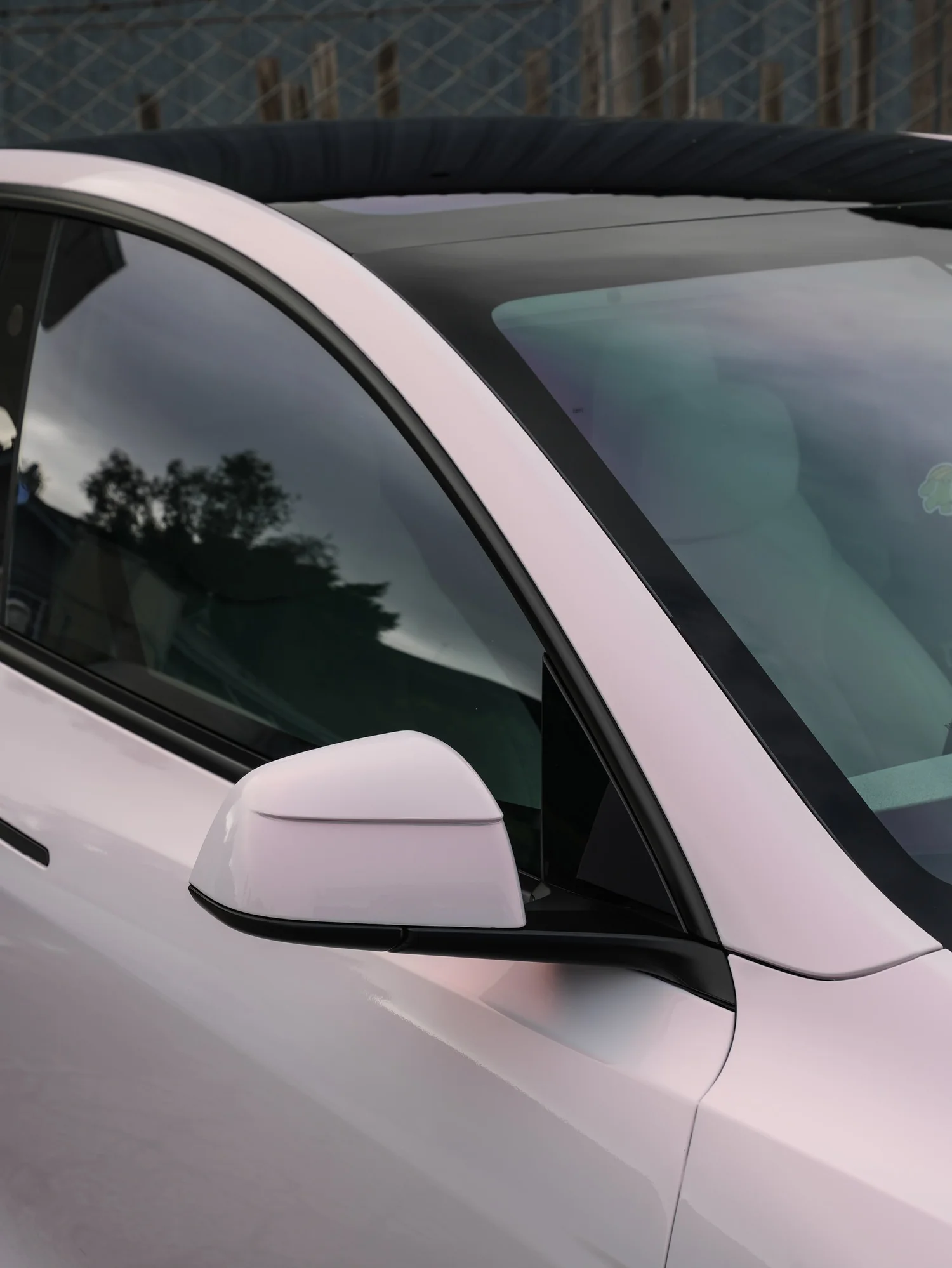 Pale Blush Pink Tesla Model Y after Vinyl Wrap, roof and glass detail