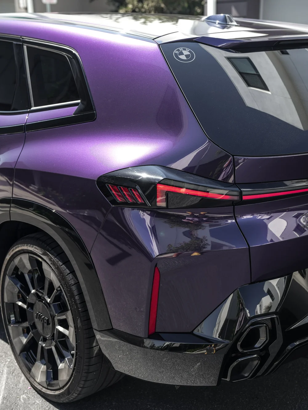 Venetian Mauve colored PPF on the BMW XM rear quarter beside the taillight and rear wheel