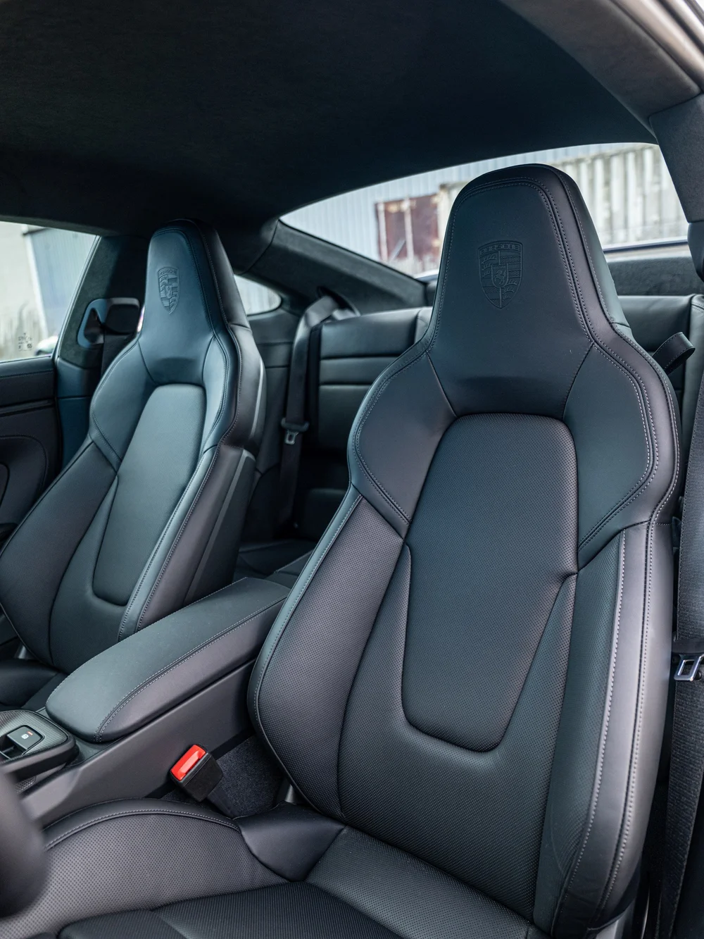 Front sport seats and center console inside a 2026 Porsche 911 Carrera 4 GTS