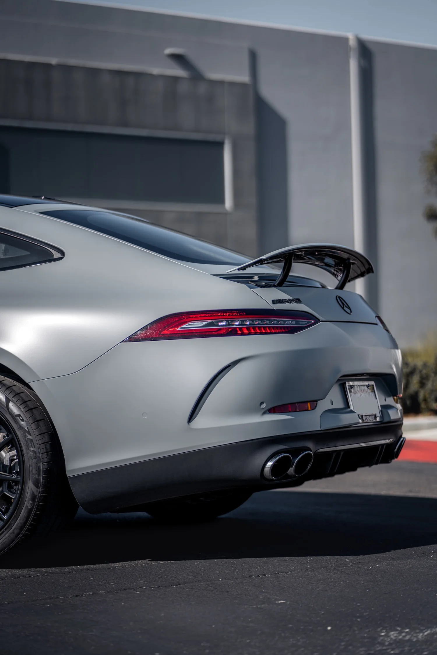 Mercedes-AMG GT 53 Avery Battleship Grey after Vinyl Wrap, low-angle rear view