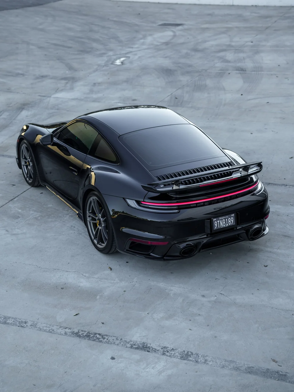 Elevated rear three-quarter view of the Porsche 911 Turbo S after PPF, window tint and ceramic coating
